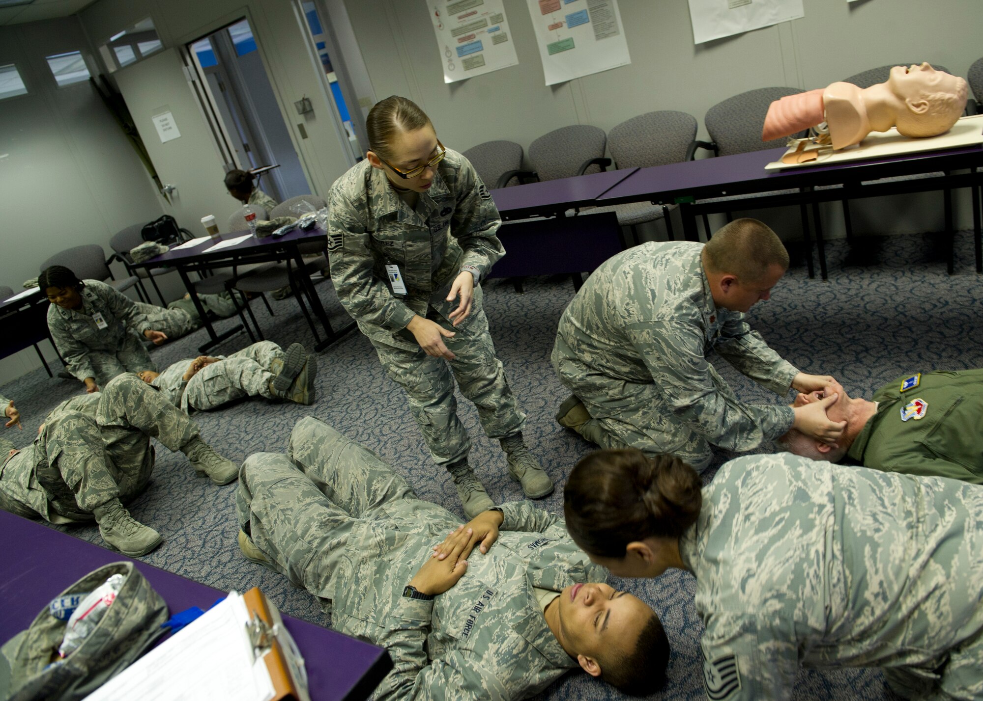HOLLOMAN AIR FORCE BASE, N.M. – Staff Sgt. Claudia Ramirez, 49th Medical Operations Squadron Self Aid and Buddy Care advisor for the 49th Wing, oversees a SABC training class March 7 at the 49th Medical Group Education and Training Flight building. Since becoming the 49th Wing’s SABC advisor in Aug. 2011, the number of the wing’s Airmen trained in SABC has gone from 30 to 80 percent. Because of the importance of SABC, the base has recently revamped its program, and in turn, an increased number of Holloman AFB Airmen have played major roles in accident response. (U.S. Air Force photo by Airman 1st Class Siuta B. Ika/Released)