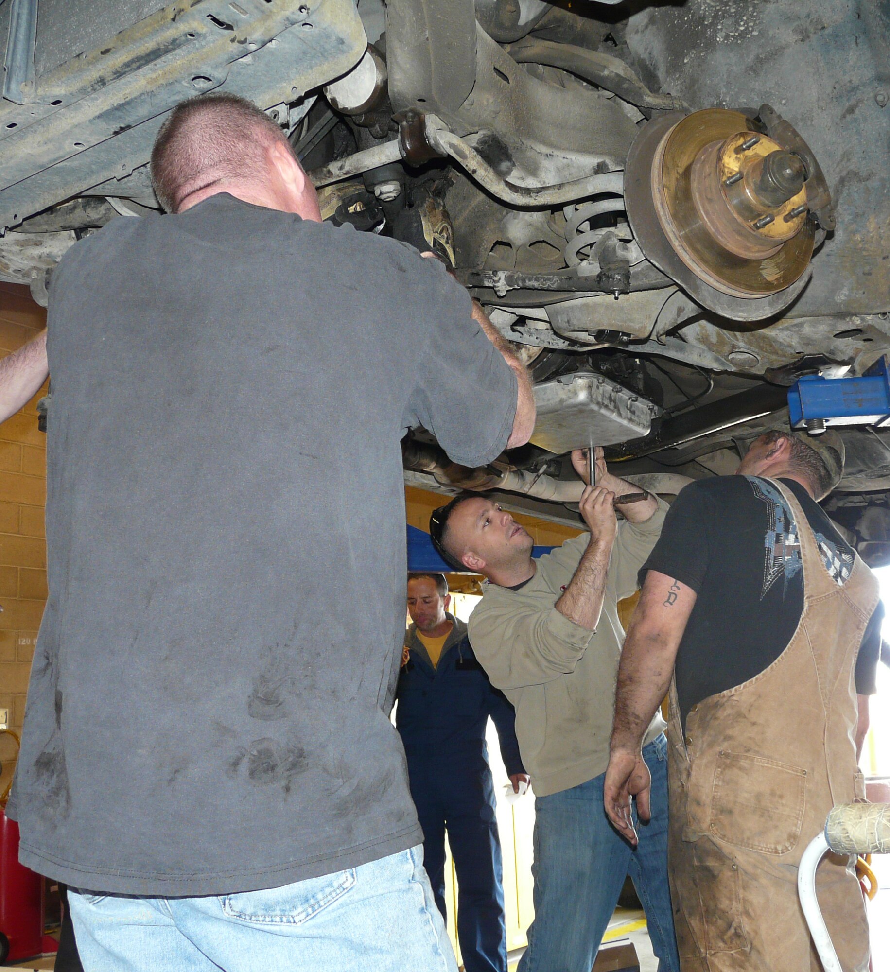 U.S. Air Force members of the 355th Equipment Maintenance Squadron conduct maintenance on the 1984 Chevy Caprice Classic at the Auto Hobby Shop on Davis-Monthan Air Force Base, Ariz. Feb. 4. The car will be presented to Tech. Sgt. Adrian Mapps once it is complete. (Courtesy photo/Released)