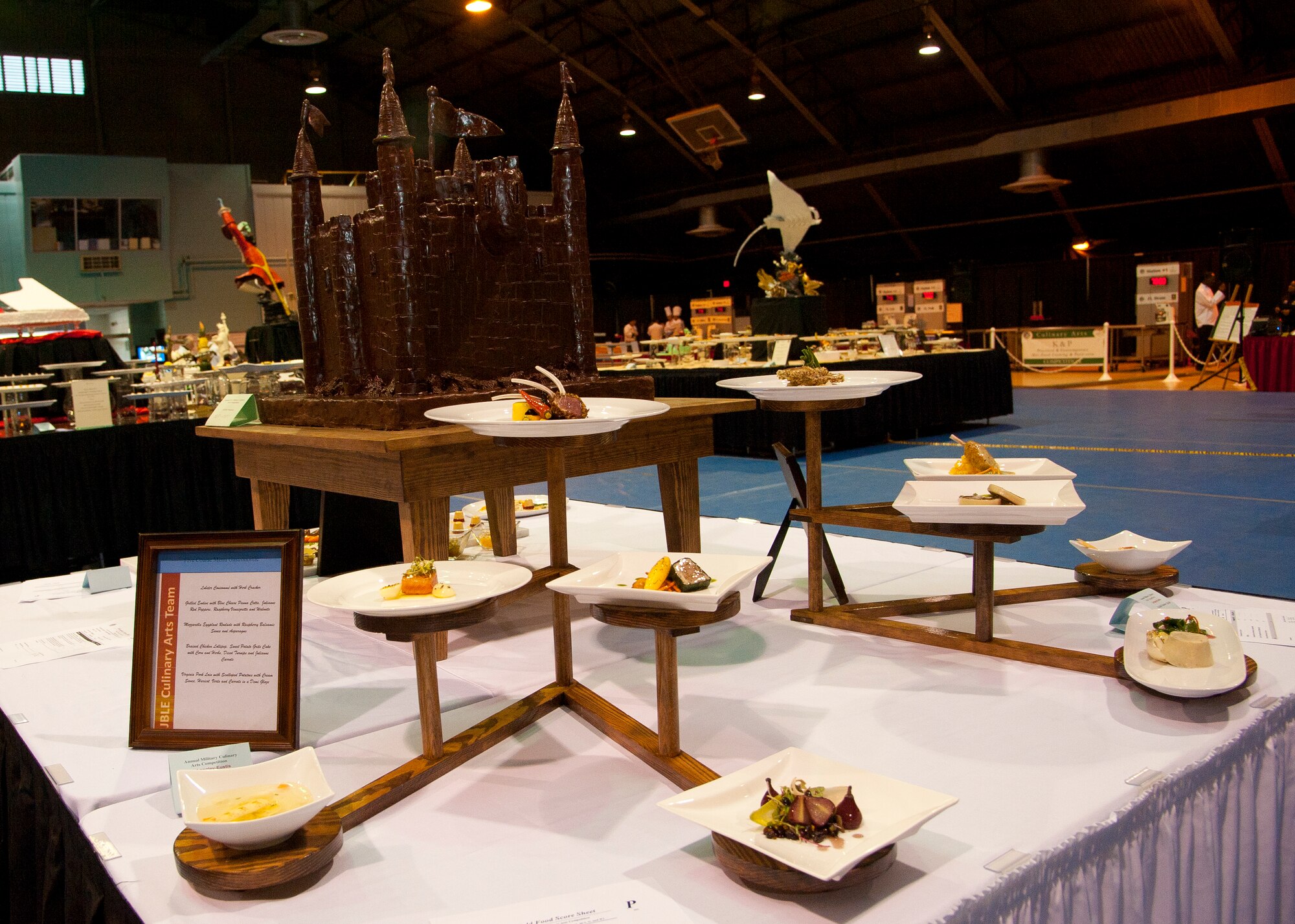 The Joint Base Langley-Eustis culinary team prepared a cold food display consisting of dishes prepared with chocolate, seafood, poultry and a variety of vegetables at the Fort Lee, Va., field house, during the 37th Annual Military Culinary Arts Competition, Mar. 6, 2012. The team included nine members that competed against more than 300 services members from around the globe in various culinary categories.  (U.S. Air Force photo by Senior Airman John D. Strong II/Released)