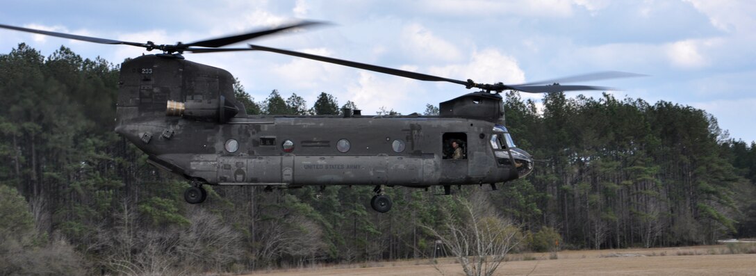 A CH-47 Chinook helicopter exfiltrates 147th Reconnaissance Tactical Air Control Party members in a simulation Feb. 6 after completing their mission during the Global Guardian Exercise in Savannah, Georgia. (Air National Guard Photo provided by 147 ASOS/Released)