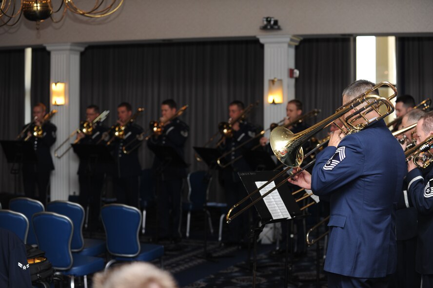 The USAF Band’s trombone ensemble plays for their new commander, Col. Larry Lang, at his assumption of command ceremony March 6 at Joint Base Anacostia-Bolling in Washington, D.C. A fellow trombonist, Lang holds the distinction of being one of nine bandsmen in the Air Force to achieve the rank of colonel. (U.S. Air Force photo/Airman 1st Class Aaron Stout)
