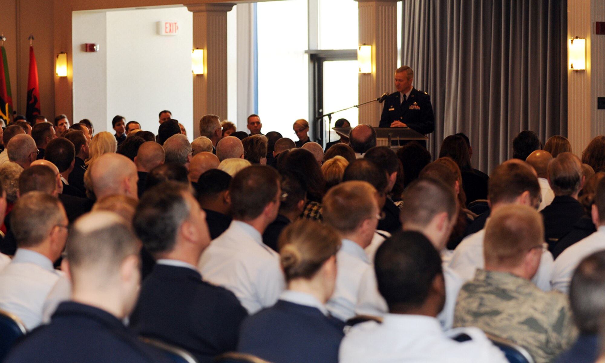 Col. Larry Lang, USAF Band commander, speaks to a full room of Airmen, family and friends after assuming command March 6 at Joint Base Anacostia-Bolling in Washington, D.C. It is customary for a commander that has just assumed power to give a speech thanking all those that helped them in their Air Force journey. (U.S. Air Force photo/Airman 1st Class Aaron Stout) 
