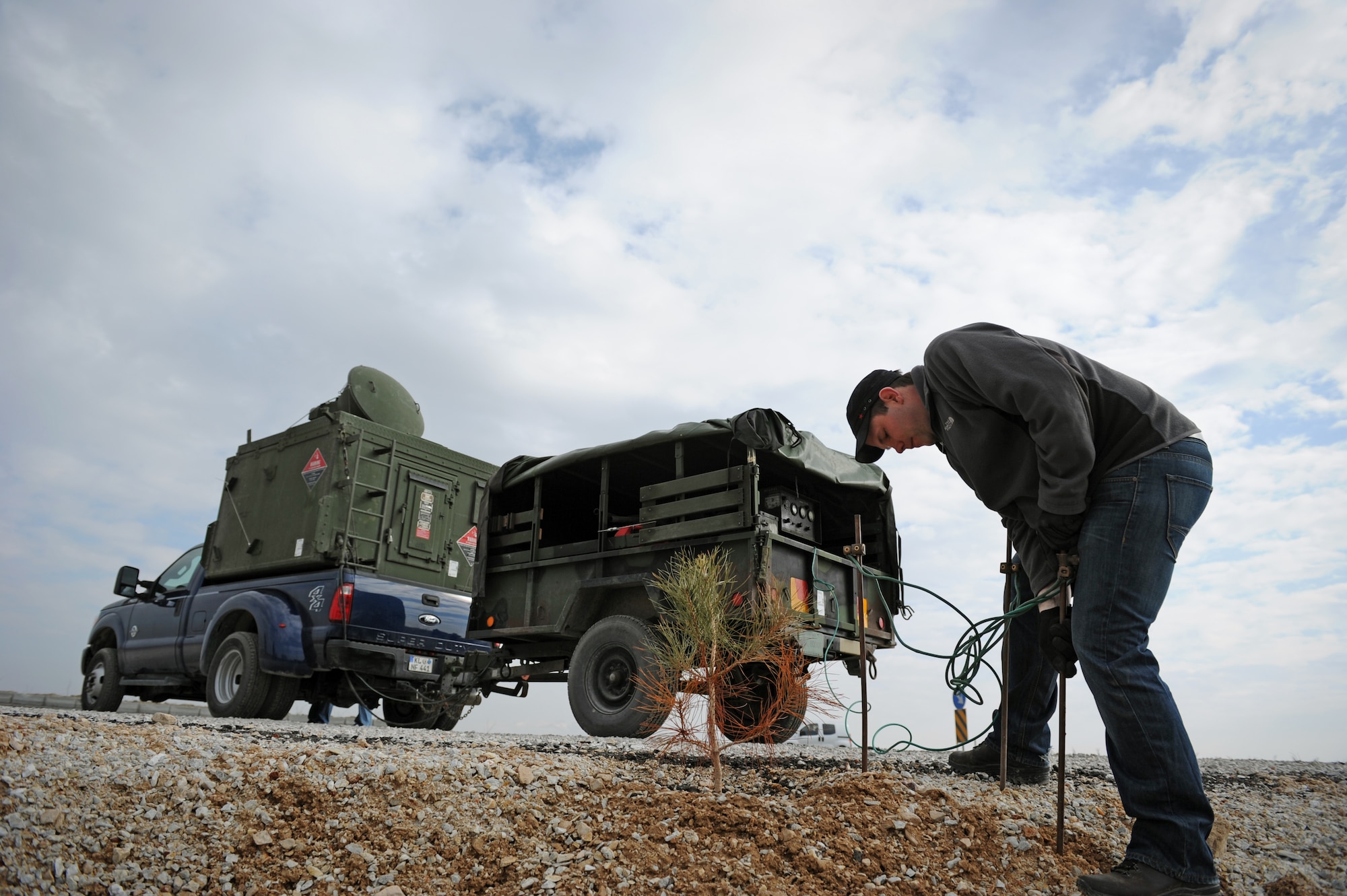 KONY, Turkey – Carl Gessman, Polygone radar operator, attaches grounding rods for a generator used to power a tactical radar threat generator during Anatolian Falcon 2012 in Konya, Turkey, March 8. The radar provided a simulated enemy ground threat capability to the participating aircraft. (U.S. Air Force photo/Staff Sgt. Benjamin Wilson)