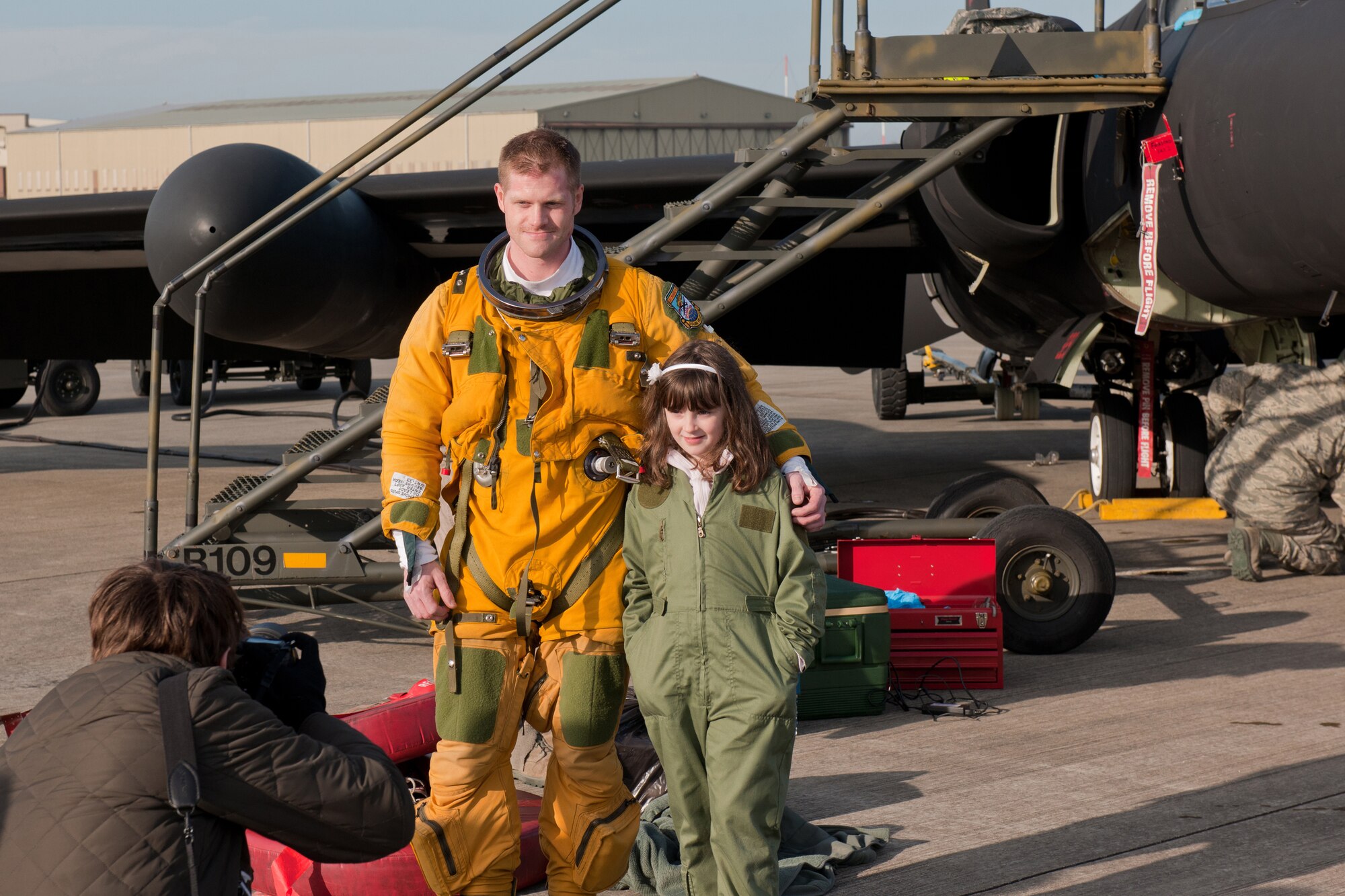 RAF FAIRFORD, United Kingdom - Capt. Geoff Jernigan, 99th Reconnaissance Squadron U-2 pilot, poses for a photo with Ellie Carter, a 9-year-old British schoolgirl who dreams of becoming the first British foreign exchange U-2 pilot. (U.S. Air Force photo by Capt. Brian Maguire)
