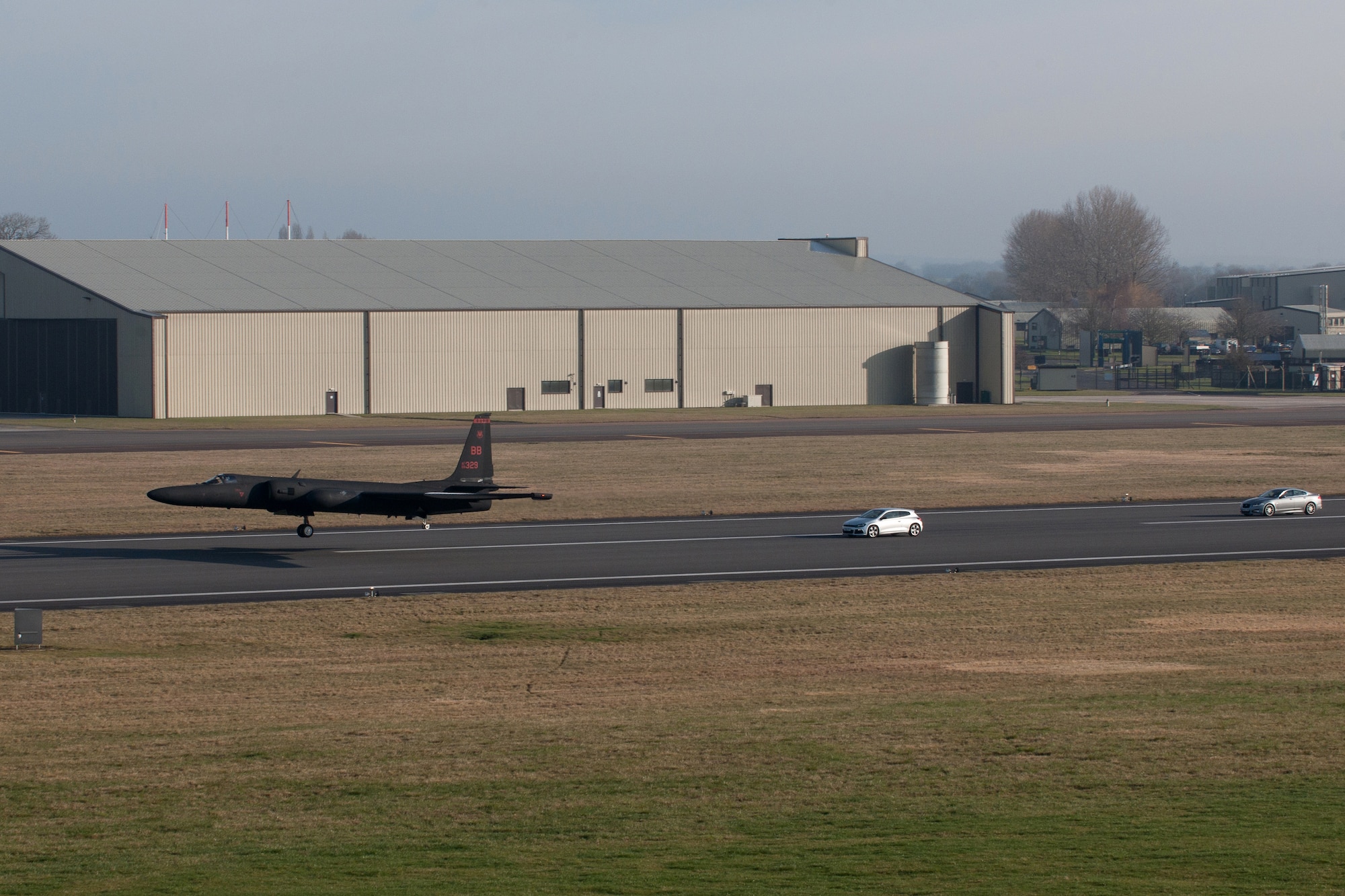 RAF FAIRFORD, United Kingdom - A U-2 Dragon Lady lands at RAF Fairford March 6. Eagerly awaiting the arrival is 9-year-old Ellie Carter, a British schoolgirl who dreams of becoming the first British foreign exchange U-2 pilot. (U.S. Air Force photo by Capt. Brian Maguire)
