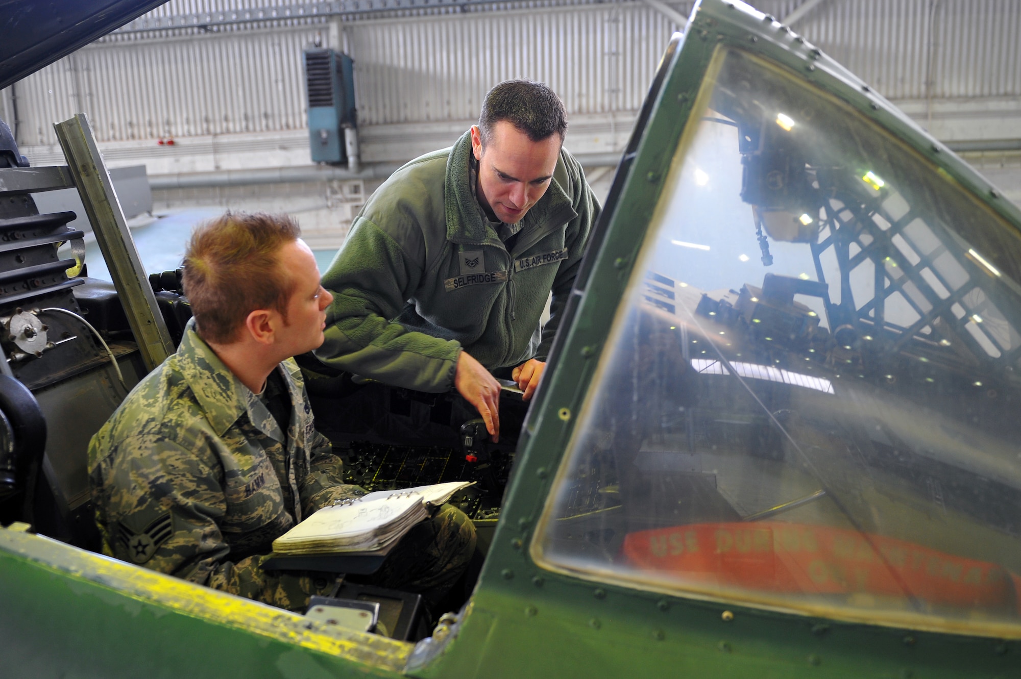 SPANGDAHLEM AIR BASE, Germany – Staff Sgt. Michael Selfridge, right, 52nd Maintenance Operations Squadron aircraft maintenance inspector, inspects Senior Airman Troy Hamm’s, 81st Fighter Squadron maintenance section journeyman, work during throttle maintenance training on an A-10 Thunderbolt II inside Hangar two here March 8. The AMXS quality assurance section is made up of eight certified maintenance inspectors who inspect 81st and 480th Fighter Squadron aircraft maintenance processes. Quality assurance modernizes the Air Force’s aircraft maintenance and training by tracking maintenance performance against metrics to improve efficiency, production, and reliability.  (U.S. Air Force photo by Airman 1st Class Dillon Davis/Released)