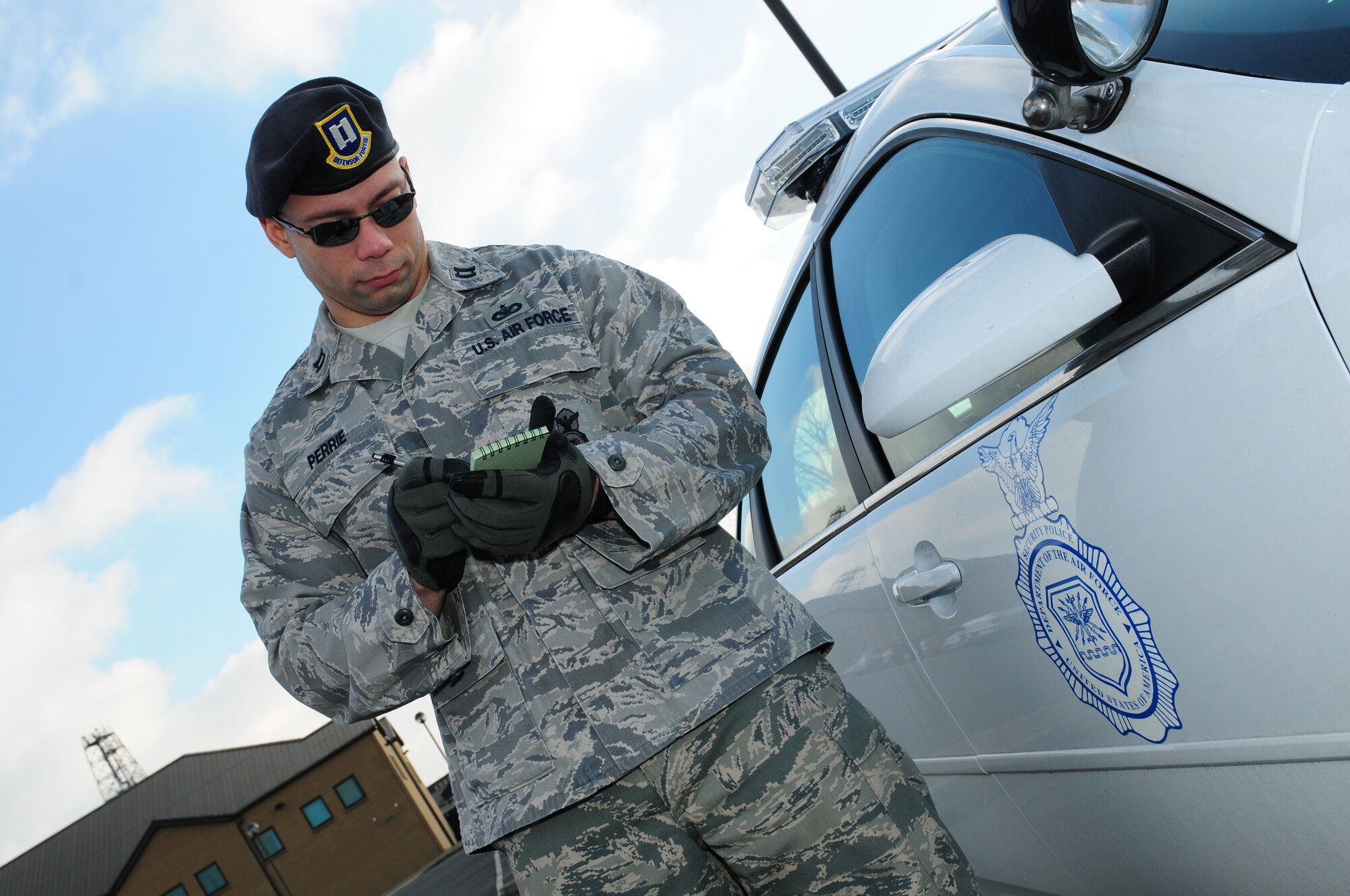 ROYAL AIR FORCE LAKENHEATH, England -- Capt. Jules Perrie, 48th Security Forces Squadron operations officer, checks his notes, Feb. 3, 2012. Perrie was nominated for a Liberty Spotlight because he displays the core value of 'Excellence in All We Do'. (U.S. Air Force photo by Airman 1st Class Cory D. Payne)