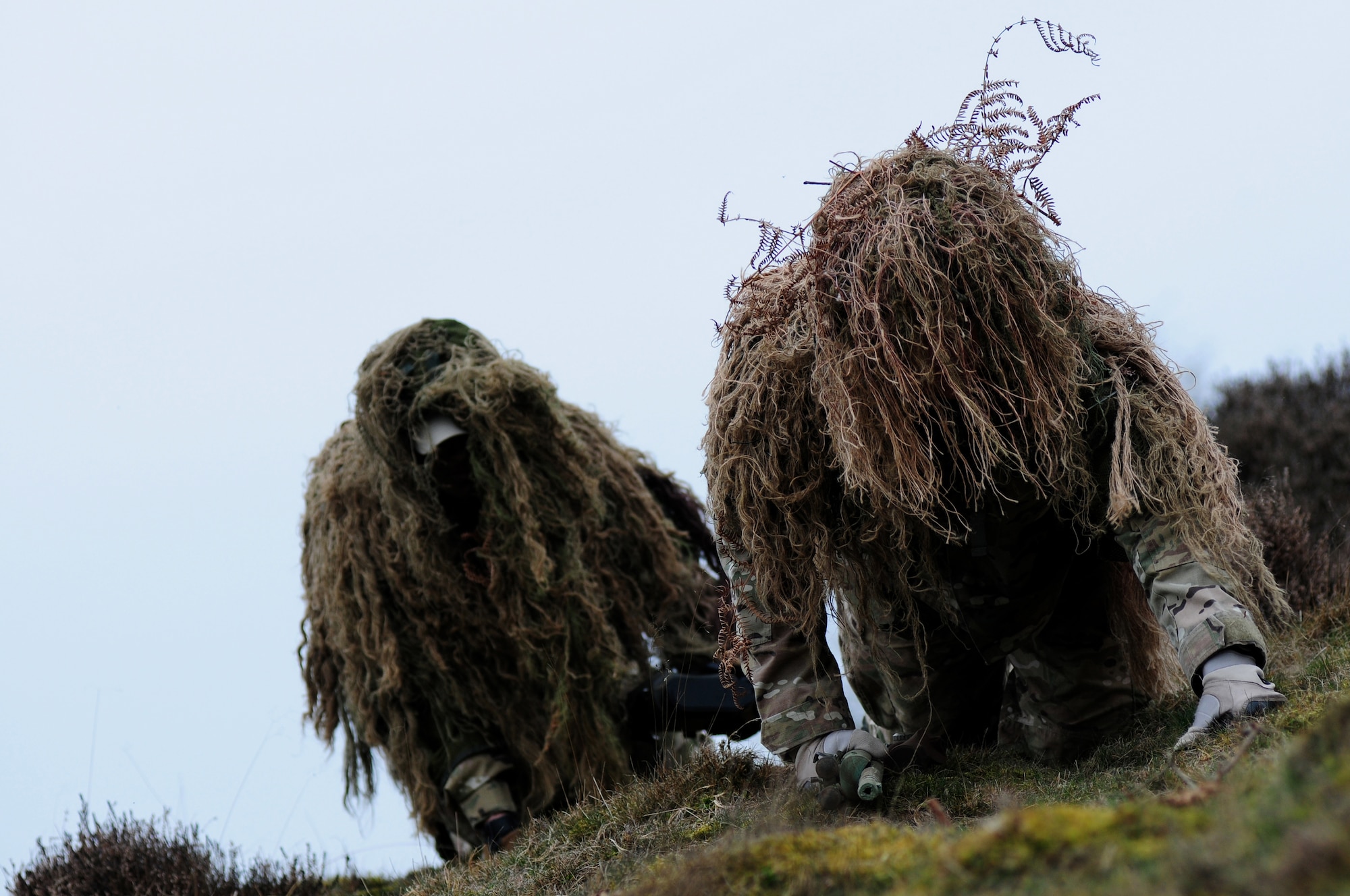 STANFORD TRAINING AREA, England – Senior Airmen Steven Trimble (right) and Otto Chanarias, 820th Base Defense Squadron close precision engagement team members, stalk a target during Regiment-hosted sniper training. “Working with (the RAF) was a good opportunity. Seeing how they operate will allow us to work better with them in the future,” said Trimble.(U.S. Air Force photo by Airman 1st Class Cory D. Payne) (Released)
 
