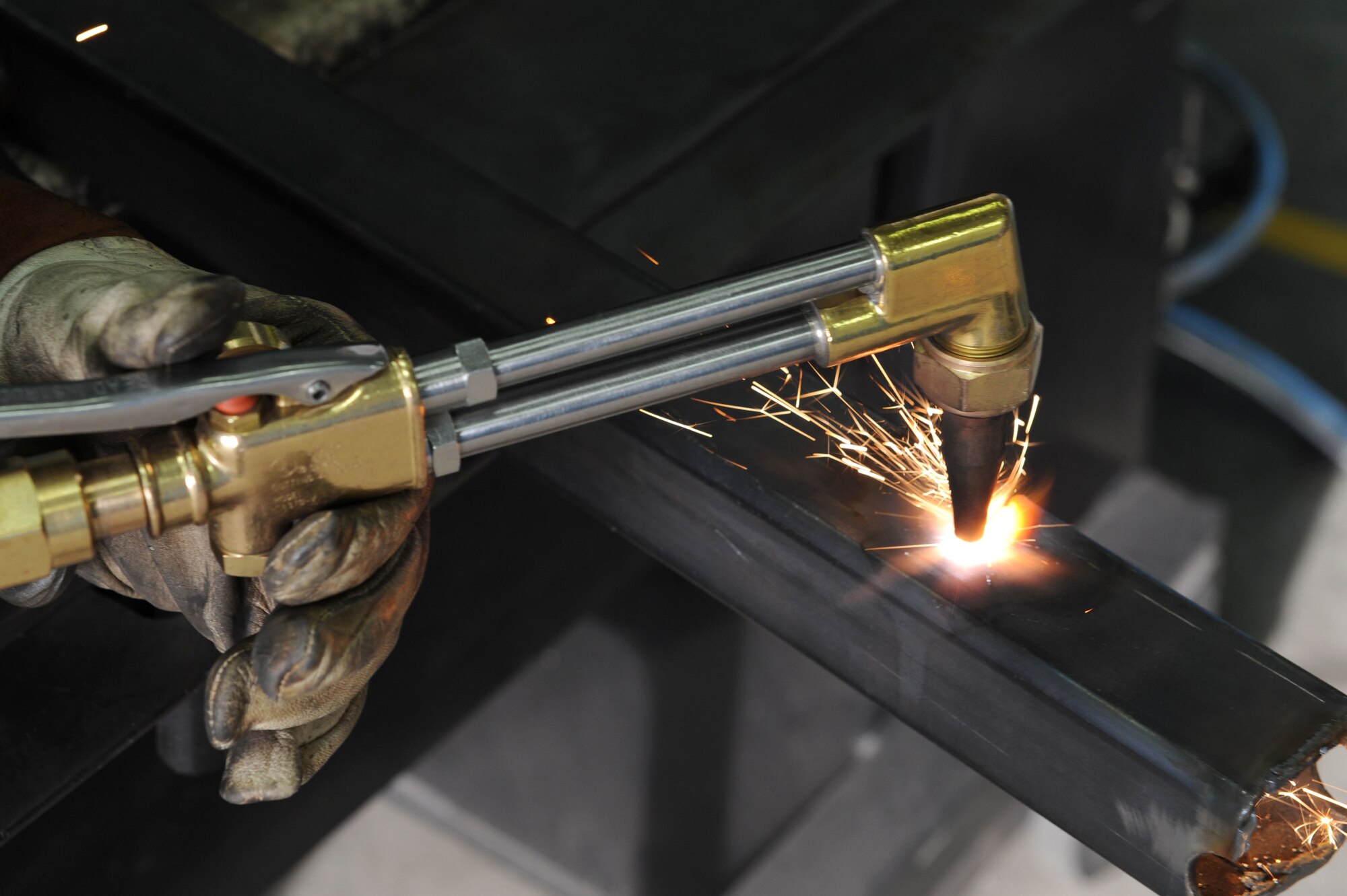 SPANGDAHLEM AIR BASE, Germany – Airman 1st Class Douglas Williams, 52 Equipment Maintenance Squadron aircraft metals technology apprentice, cuts steel tubing for fabrication use at Bldg. 41 here March 7.  The fabrication flight repair aircraft and support equipment fabricate assets that cannot be bought using computer numerical controlled machines and welding equipment. Fabrication keep 51 F-16 and A-10 aircraft repaired, as well as equipment and facilities worth over $992 million ready to provide combat power to the current flight through precise repairs to all assets. (U.S. Air Force photo by Senior Airman Christopher Toon/Released)