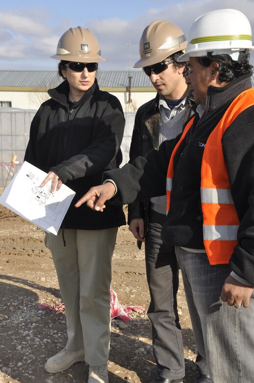 AFGHANISTAN — Ayesha Saeed (left), a project engineer at the Herat Resident Office and Baltimore resident, checks on the status of a construction project on Camp Zafar Jan 31, 2012.