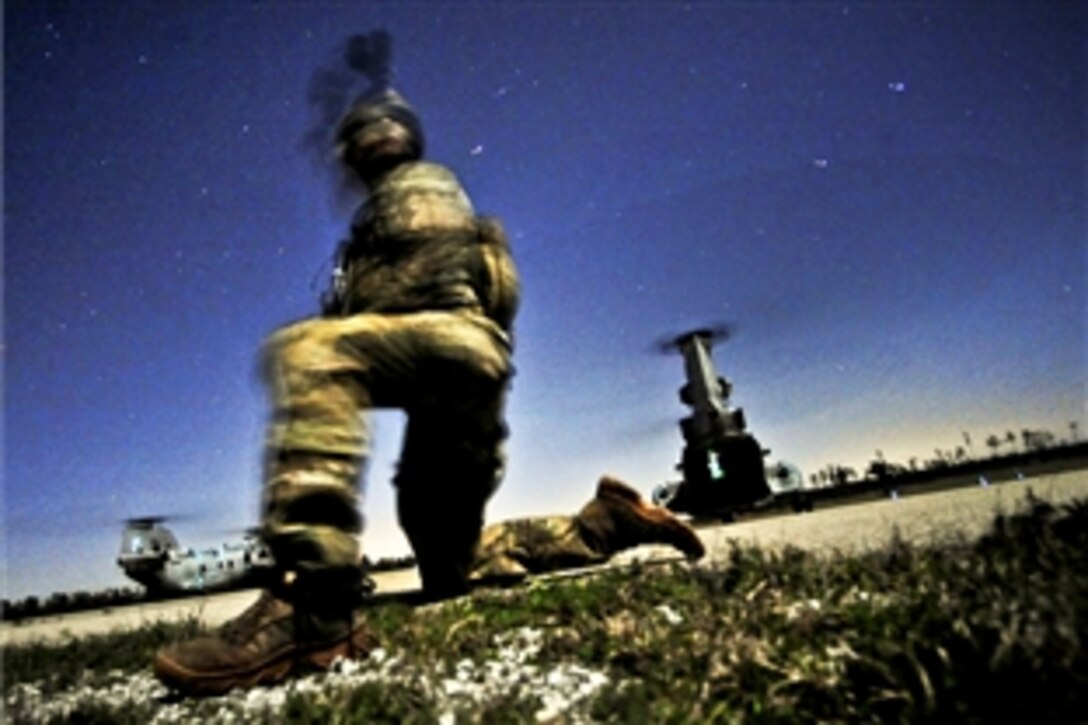 A U.S. soldier conducts a night raid mission during Emerald Warrior 2012, near Hattiesburg, Miss., March 5, 2012. The primary purpose of Emerald Warrior is to exercise special operations components in urban and irregular warfare settings to support combatant commanders in theater campaigns. 