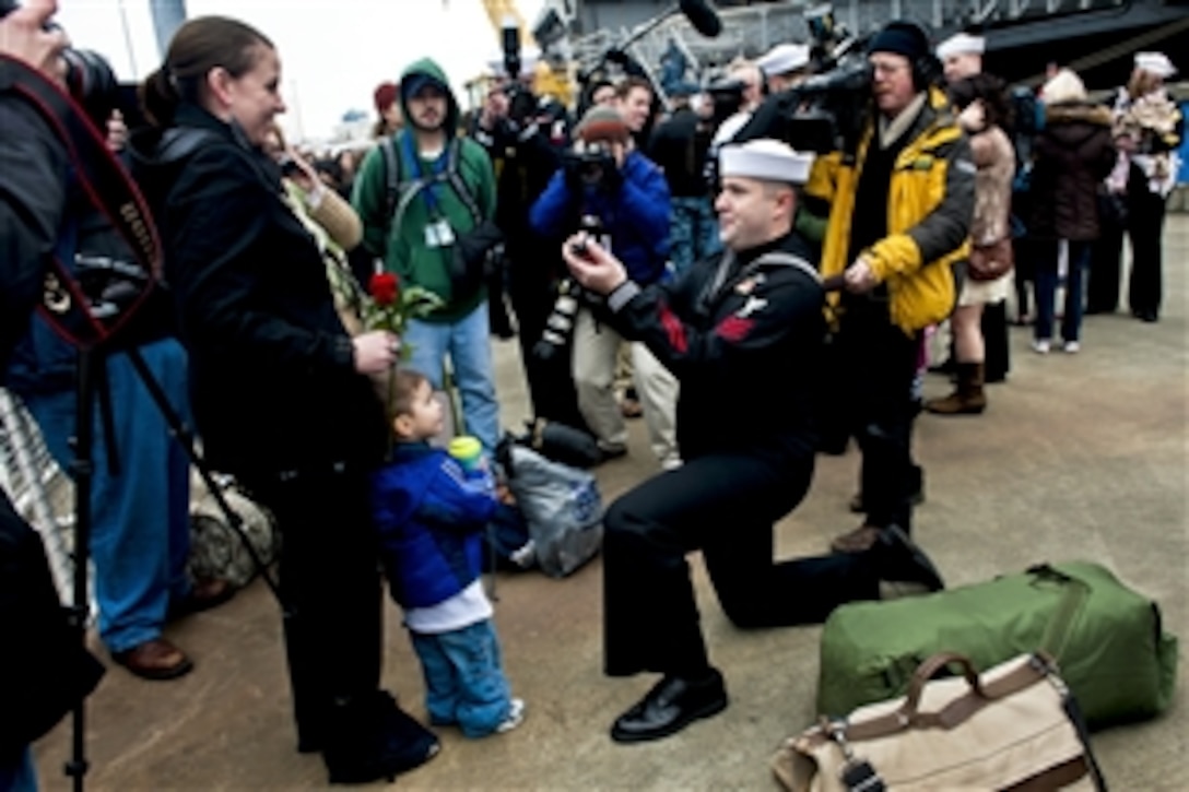 Navy Petty Officer 1st Class Christopher Kight proposes to his girlfriend after disembarking from the aircraft carrier USS John C. Stennis in Bremerton, Wash., March 2, 2012. The John C. Stennis is returning from a seven-month deployment. Kight is a damage controlman.