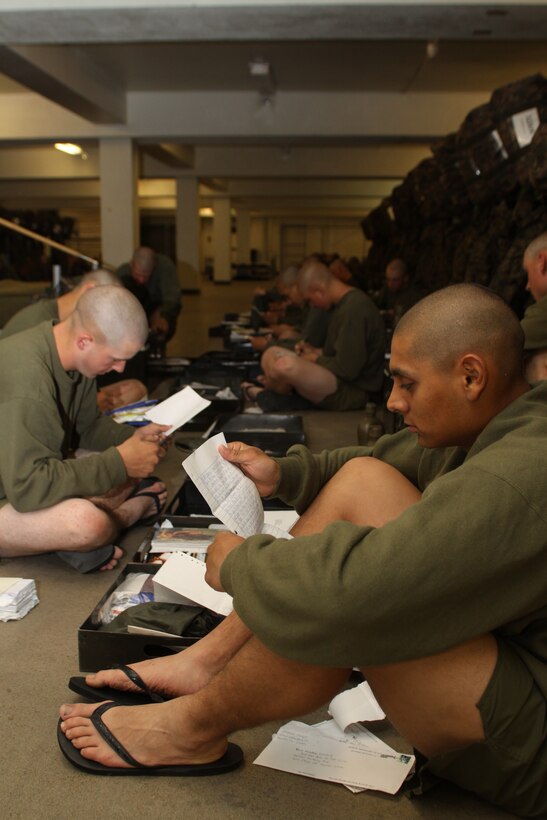 Recruit Kevin Mendeola, Platoon 3226, Company K, 3rd Recruit Training Battalion, reads a letter from home during 'square away time' March 8 aboard Marine Corps Recruit Depot San Diego. During the 12 weeks aboard the depot recruits rely on letters from family and friends for motivation to push through each training day.
