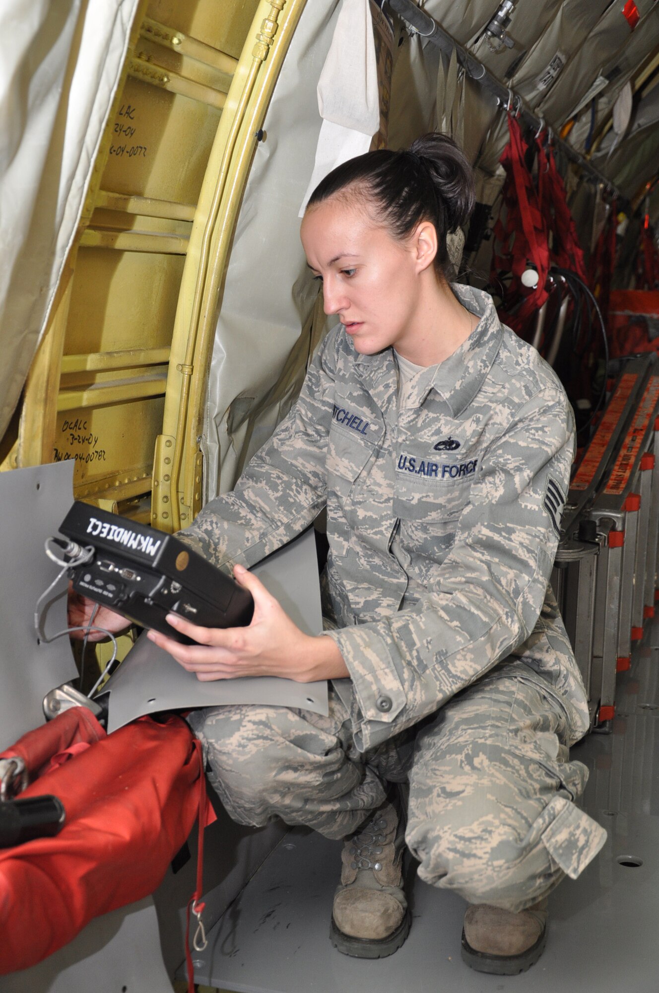 Staff Sgt. Amanda Mitchell, 931st Maintenance Squadron, uses an eddy current probe to search for surface and near-surface cracks on the bulkhead of a KC-135 Stratotanker. (Air Force photo by Tech. Sgt. Brannen Parrish)