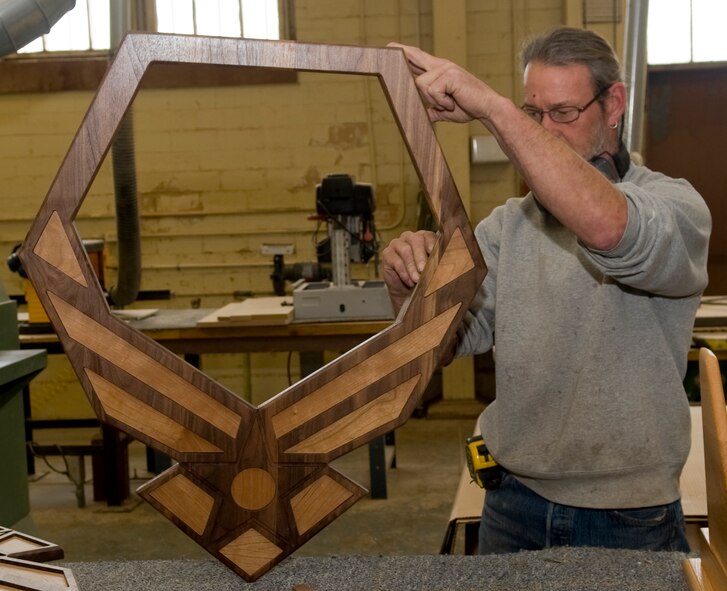 Mike Jarrett, 2nd Force Support Squadron Wood Craft Center manager, fixes a shadow box in the Arts & Crafts Center on Barksdale Air Force Base, La., March 9. Jarrett teaches a wood shop class to help Team Barksdale members understand how to build projects and be safe in the wood shop. The class allows attendees to build a two-shelf bookcase during the eight-hour course. (U.S. Air Force photo/Senior Airman Kristin High)(RELEASED) 