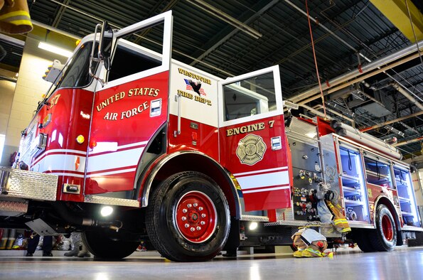 Westovers Fire Department members "pushed in" their new Engine 7 vehicle on March 9, 2012. Part of the traditional housing ceremony includes having the firefighters push the new apparatus into the firehouse. The origin is reported to be from the time of horse drawn equipment which could not be easily backed into the building by the horses. (U.S. Air Force photo/SrA. Kelly Galloway)