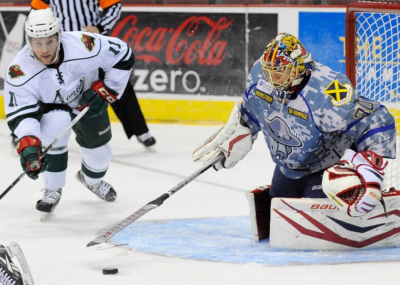 Rampage goalie Jacob Markstrom tracks the puck as Houston Aeros right wing Rob Mignardi zeroes in during Saturday’s game at the AT&T Center. (Courtesy photo/Darren Abate, SA Rampage Media)
