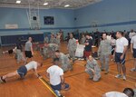 Members of various organizations from Joint Base San Antonio-Lackland participated in the JBSA-Lackland Top III’s 2012 Bi-Annual Push-Up-A-Thon March 2 at the Chaparral Fitness Center. The event saw a clean sweep as the Headquarters Air Force Services Agency raised the most money in individual and unit categories. (U.S. Air Force photo/Alan Boedeker)