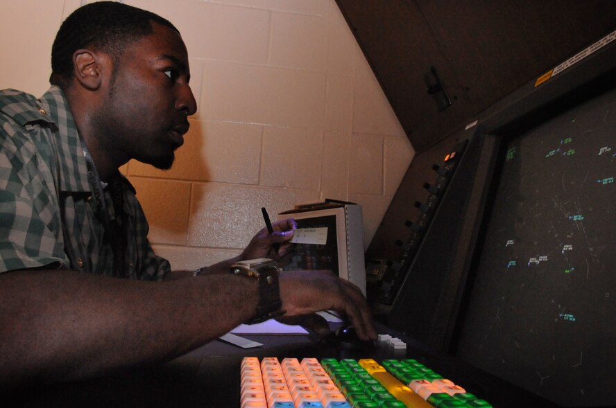 Derrick Alexander, a Federal Aviation Administration certified professional controller, views aircraft on a display simulator at the Shreveport Radar Approach Control facility at Barksdale Air Force Base, La., March 8. The Shreveport RAPCON, in addition to standard traffic control operations, is unique in that it is located on the Air Force base and works in partnership with the 2nd Operations Support Squadron to facilitate both military and civilian flight operations within a 60 mile radius of the base. (U.S. Air Force photo/Tech. Sgt. Mike Andriacco)(RELEASED)