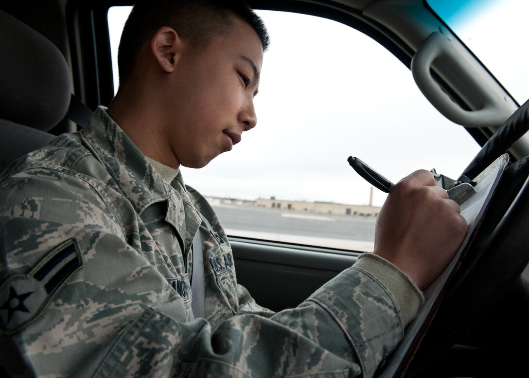 Airman 1st Class Jonathan Yang, 28th Operations Support Squadron airfield management technician, evaluates maintenance equipment handling procedures on the flightline at Ellsworth Air Force Base, S.D., March 7, 2012. Yang ensures that all maintenance equipment on the flightline has been cleared after maintenance is completed. (U.S. Air Force photo by Airman Alystria Maurer/Released)