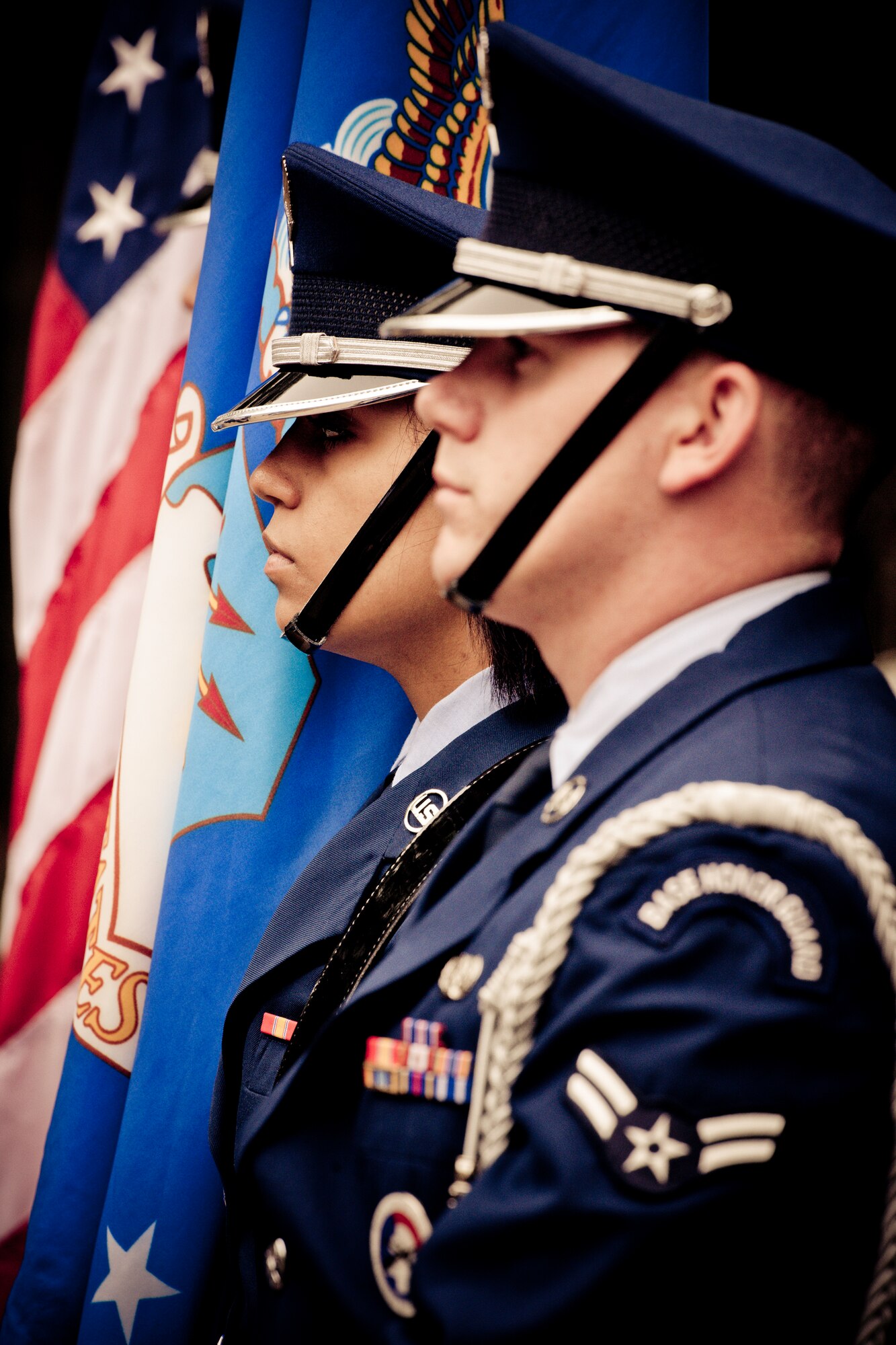 Senior Airman David Rebholz and Airman 1st Class Kasey Roberts were part of the flag detail during a military funeral performance at the honor guard graduation at Eglin Air Force Base, Fla.  Approximately 16 new Airmen graduated from the 80-plus-hour course.  Prior to the graduation, the Airmen perform a full honors, military funeral to include flag detail, the 21-gun salute, pall bearers and bugler for friends, family and unit commanders.  (U.S. Air Force photo/Samuel King Jr.)