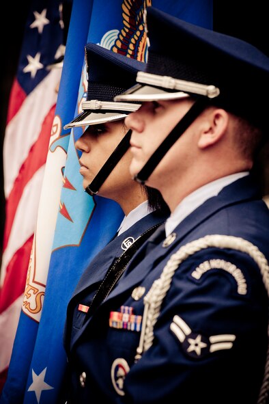 Senior Airman David Rebholz and Airman 1st Class Kasey Roberts were part of the flag detail during a military funeral performance at the honor guard graduation at Eglin Air Force Base, Fla.  Approximately 16 new Airmen graduated from the 80-plus-hour course.  Prior to the graduation, the Airmen perform a full honors, military funeral to include flag detail, the 21-gun salute, pall bearers and bugler for friends, family and unit commanders.  (U.S. Air Force photo/Samuel King Jr.)