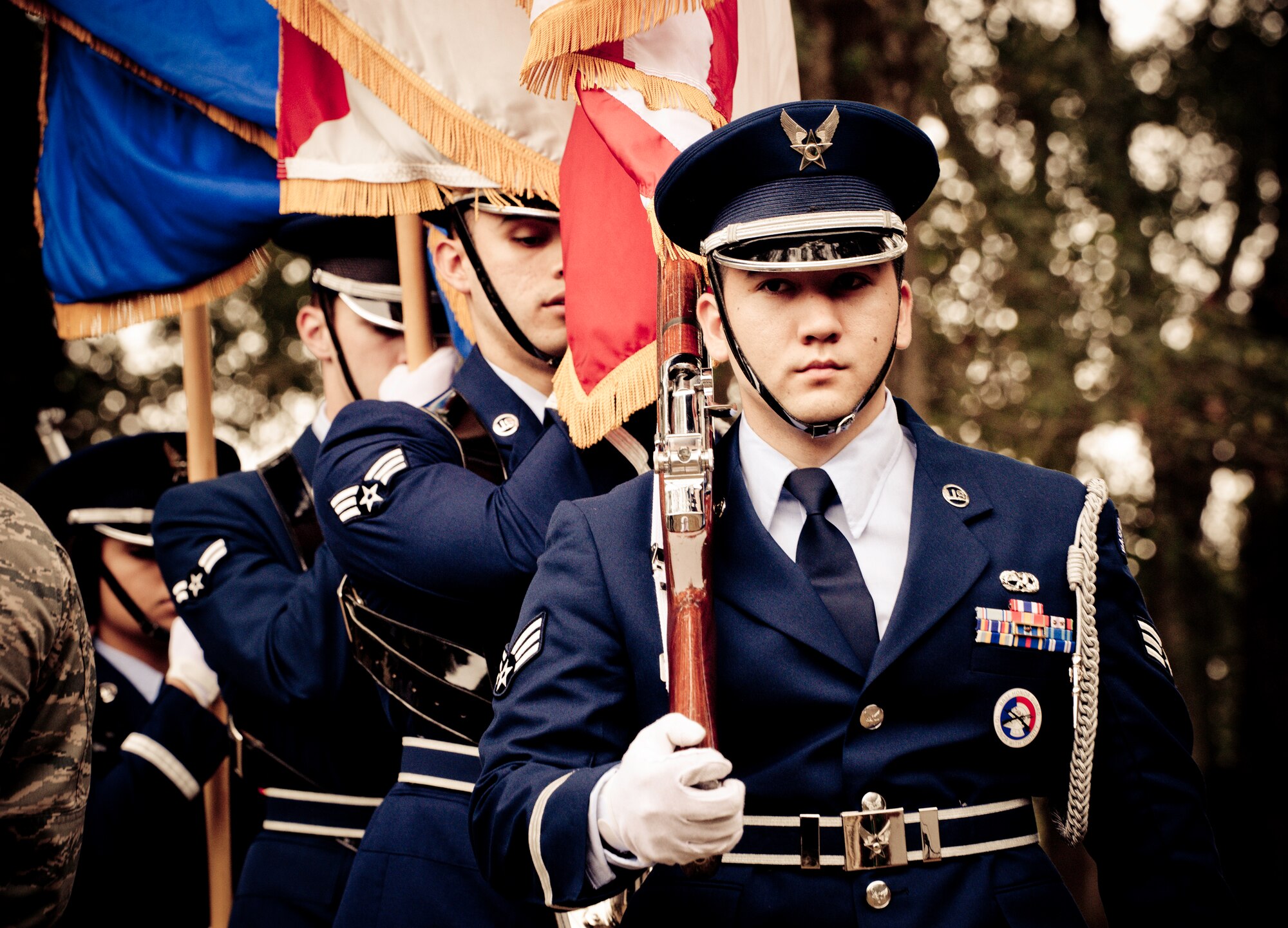 Airman 1st Class Eric Esser leads the flag detail at the honor guard graduation ceremony at Eglin Air Force Base, Fla.  Approximately 16 new Airmen graduated from the 80-plus-hour course.  Prior to the graduation, the Airmen perform a full honors, military funeral to include flag detail, the 21-gun salute, pall bearers and bugler for friends, family and unit commanders.  (U.S. Air Force photo/Samuel King Jr.)