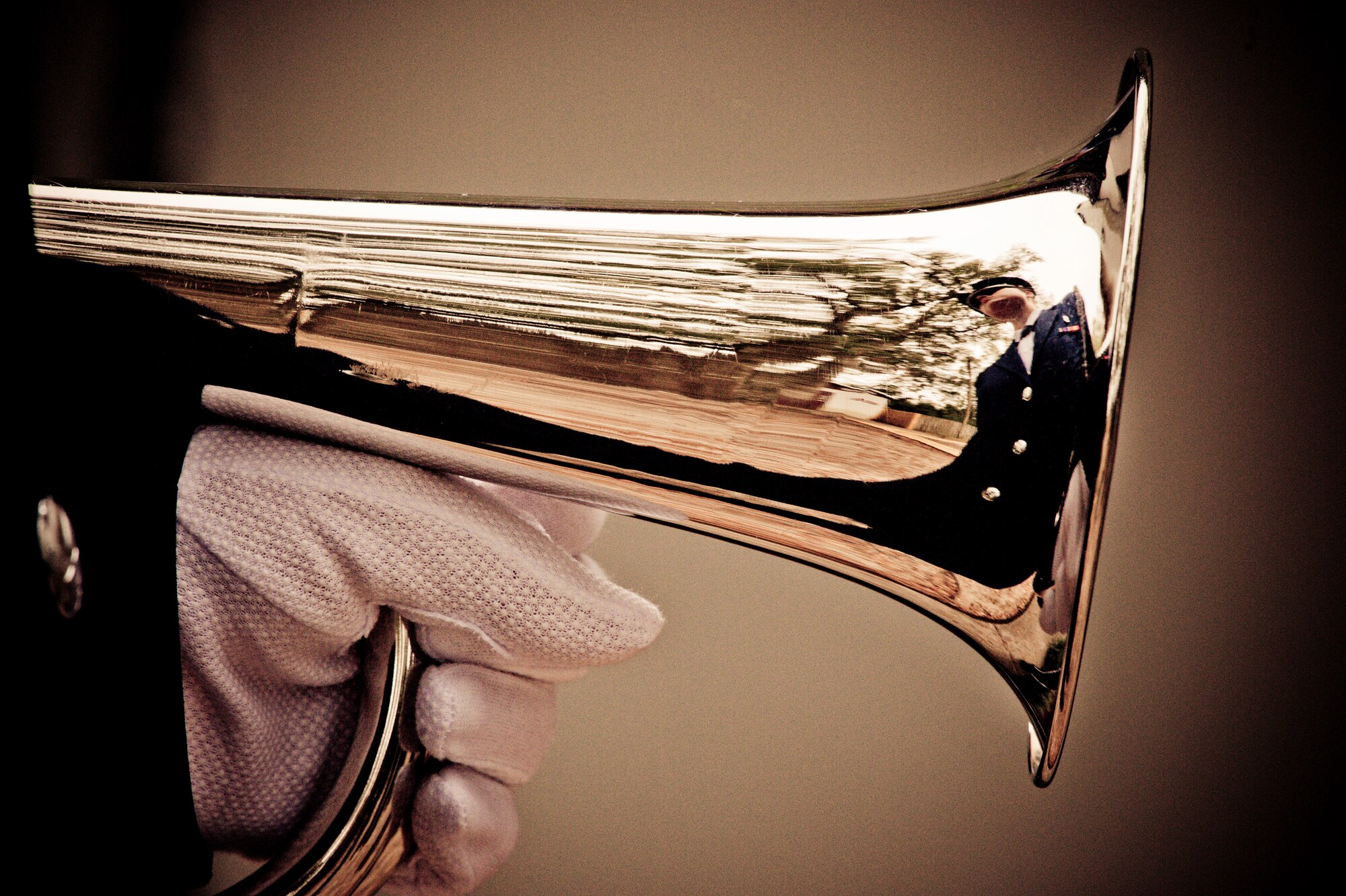 Airman 1st Class Brittany White, of the Eglin Honor Guard, holds her bugle prior to a military funeral performance at the honor guard graduation at Eglin Air Force Base, Fla.  Approximately 16 new Airmen graduated from the 80-plus-hour course.  Prior to the graduation, the Airmen perform a full honors, military funeral to include flag detail, the 21-gun salute, pall bearers and bugler for friends, family and unit commanders.  (U.S. Air Force photo/Samuel King Jr.)