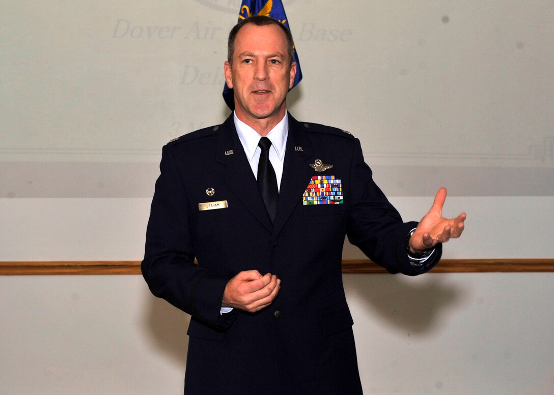 Lt. Col. Robert P. Graham, 326th Airlift Squadron commander, addresses the audience inside the 512th Operations Group building during a ceremony March 3, 2012, when he accepted command of the the C-17 flying unit. Graham comes to the 512th Airlift Wing from Charleston Air Force Base, S.C., where he served as the 300th AS commander. Lt. Col. David Arthur, the previous commander of the 326th AS, remains a member of the 512th Operations Group as the assistant chief of standardization and evaluation. (U.S. Air Force photo by Tech. Sgt. Chuck Walker)