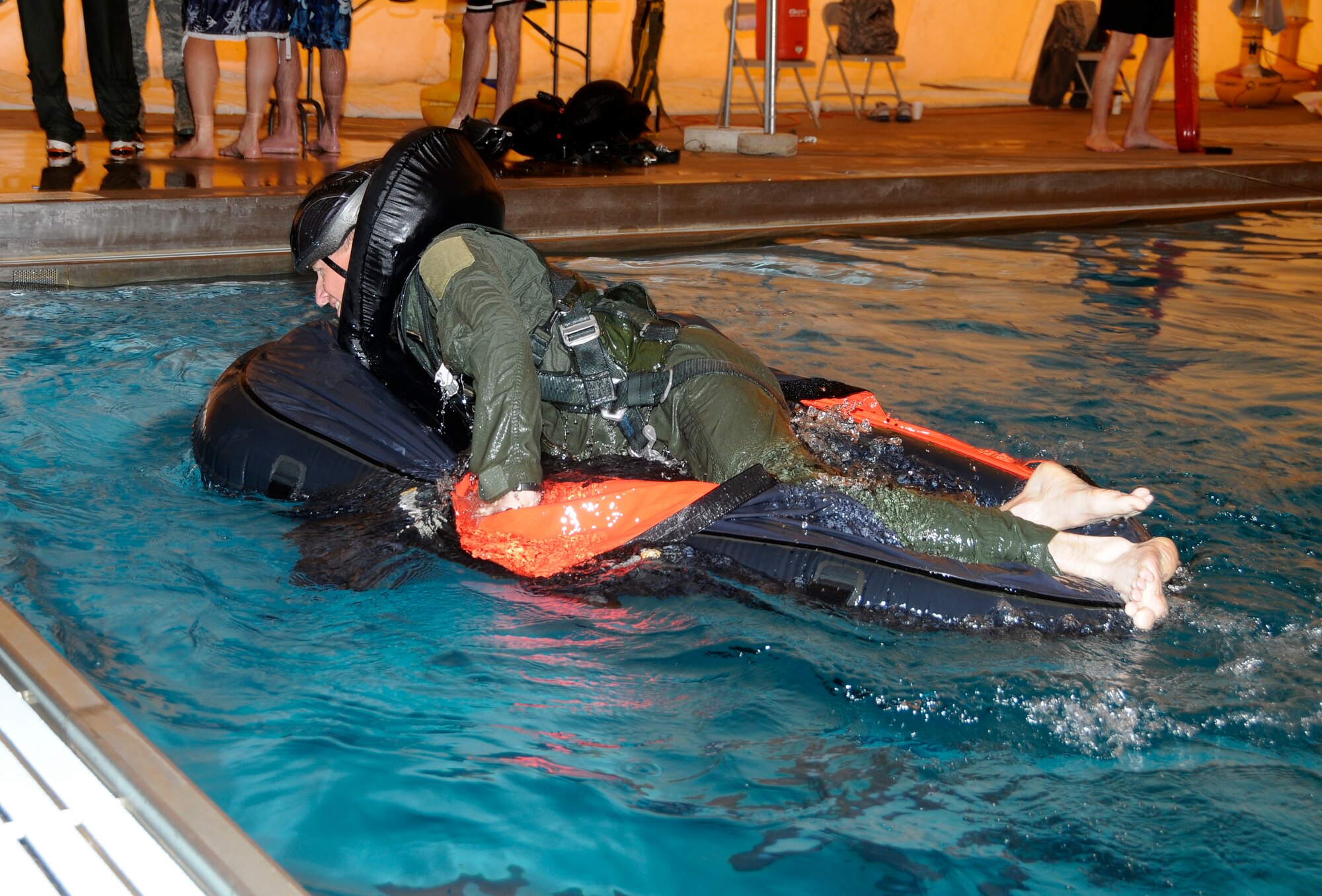 Specialists with the 188th Operations Group’s Life Support Element administer water survival training to pilots with the 184th Fighter Squadron of the 188th Fighter Wing at Creekmore Park in Fort Smith, Ark., March 4, 2012. The training is required for aviators prior to deploying. The objective of the training is to prepare pilots for the potential of ejecting from their A-10C Thunderbolt II “Warthogs” while flying over water. The 188th Fighter Wing will deploy to Afghanistan this summer in support of Operation Enduring Freedom. It will be the unit’s second combat deployment in the A-10. (National Guard photo by Airman 1st Class Hannah Landeros/188th Fighter Wing Public Affairs)


