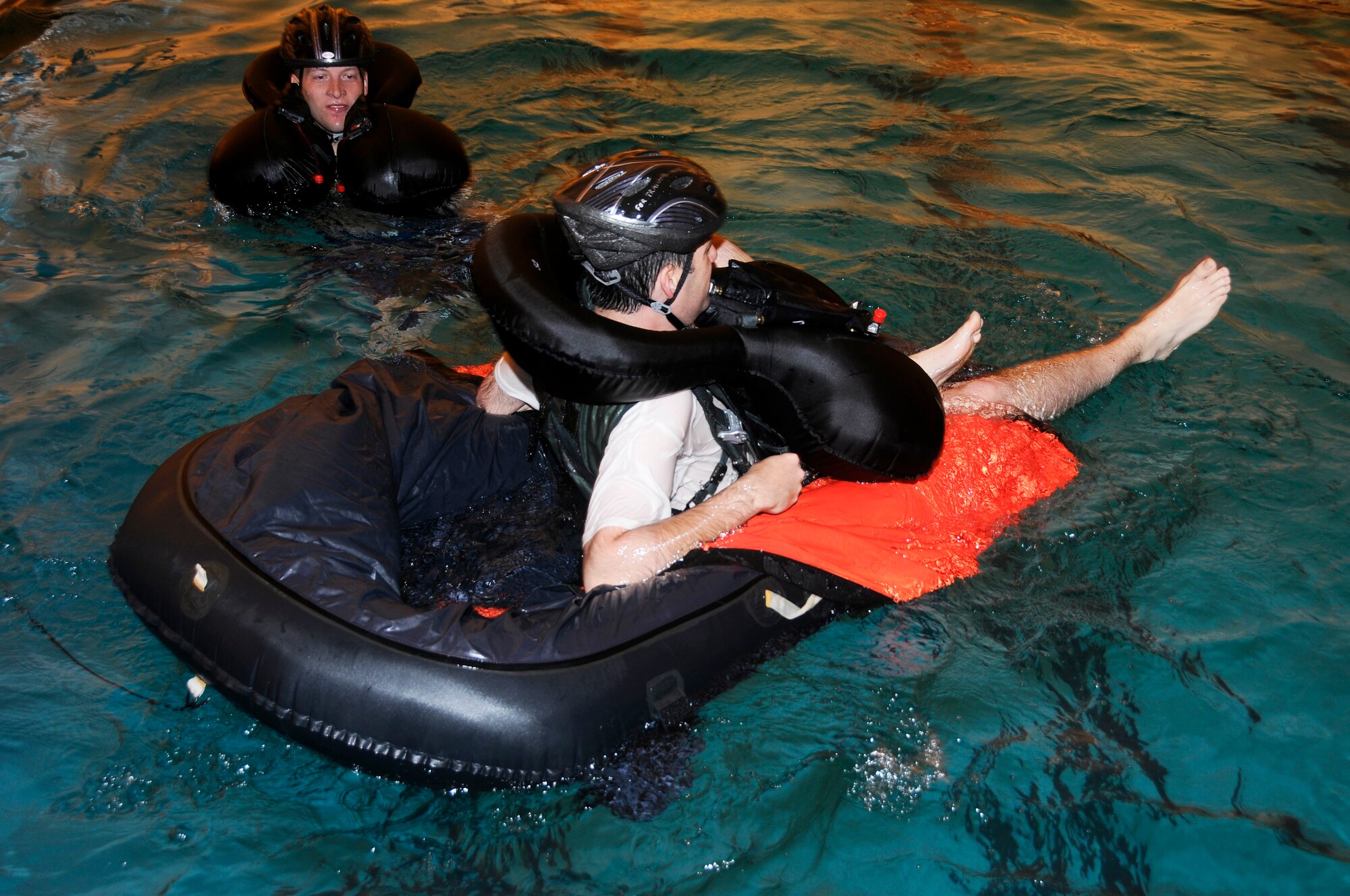 Specialists with the 188th Operations Group’s Life Support Element administer water survival training to pilots with the 184th Fighter Squadron of the 188th Fighter Wing at Creekmore Park in Fort Smith, Ark., March 4, 2012. The training is required for aviators prior to deploying. The objective of the training is to prepare pilots for the potential of ejecting from their A-10C Thunderbolt II “Warthogs” while flying over water. The 188th Fighter Wing will deploy to Afghanistan this summer in support of Operation Enduring Freedom. It will be the unit’s second combat deployment in the A-10. (National Guard photo by Airman 1st Class Hannah Landeros/188th Fighter Wing Public Affairs)

