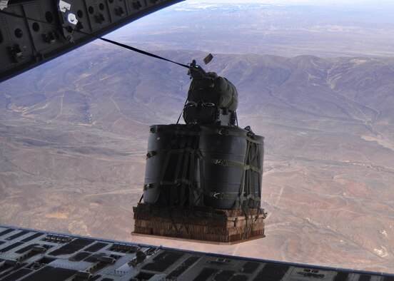 Airmen from the 62nd Airlift Wing successfully completed the first continental C-17 Globemaster III Joint Precision Airdrop System, or JPADS, airdrop during routine training March 8, 2012, by dropping two bundles equaling 2,900 pounds at Yakima Training Center, Wash. Traditional airdrops by Air Force airlifters are at altitudes of anywhere between 400 and 1,000 feet. With JPADS, aircraft have the potential to guide air drop bundles from as high as 25,000 feet. (U.S. Air Force photo/Airman 1st Class Leah Young)