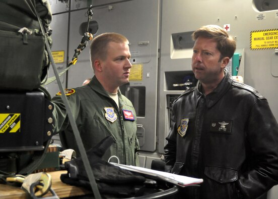 Staff Sgt. Todd Tichawa, left, 62nd Operations Support Squadron loadmaster, briefs Col. Wyn Elder, 62nd Airlift Wing commander, before the first continental C-17 Globemaster III JPADS airdrop March 8, 2012, at Joint Base Lewis-McChord, Wash. (U.S. Air Force photo/Airman 1st Class Leah Young)