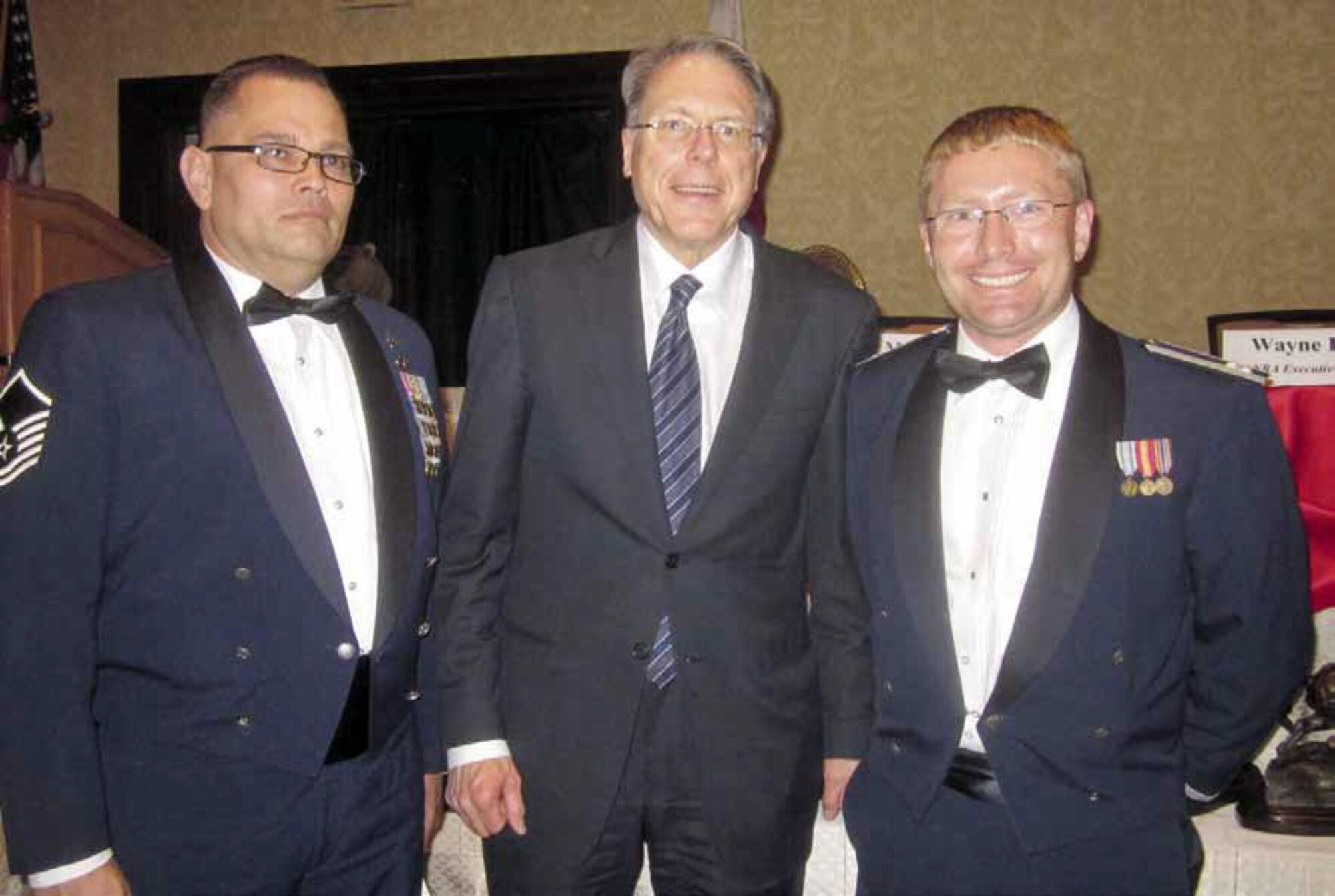 Master Sgt. Chris Huss, 163d Medical Group; Wayne LaPierre, National Rifle Association CEO; and Capt. Kel Thede, 163rd Reconnaissance Wing public affairs, at the California Rifle and Pistol Associations 2012 Awards Banquet. Military members were CRPA guests at the 137th annual Gala themed “Honoring America’s Heroes.” (U.S. Air Force photo courtesy from Capt. Kel Thede)