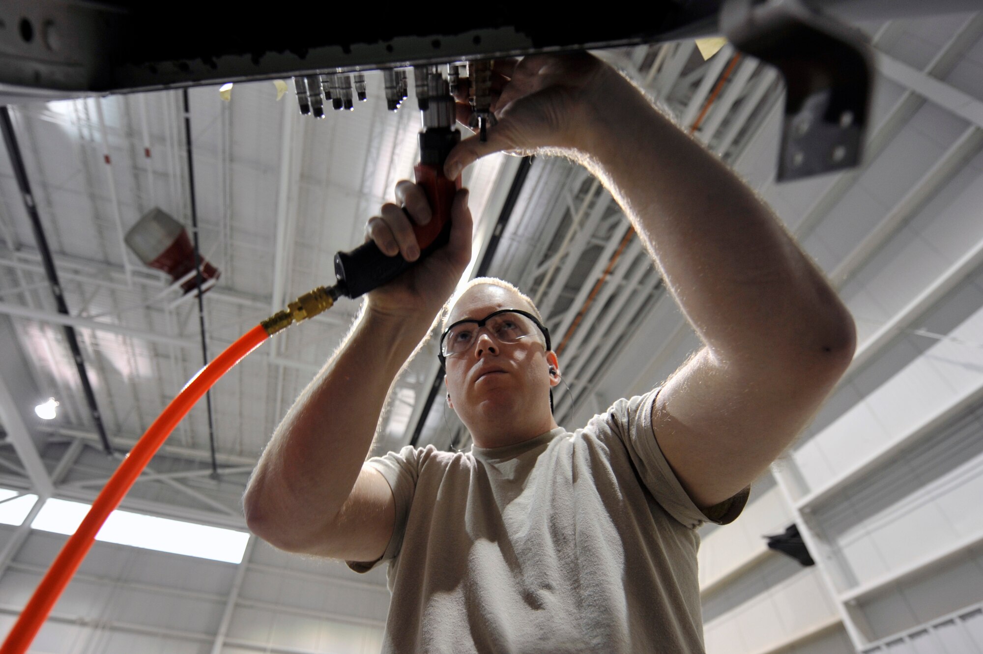 Tech. Sgt. Kevin Riegel, a 402nd Expeditionary Depot Maintenance depot structural craftsman at Robins Air Force Base, Ga., drills a doubler filler plate into a C-130, March 8, 2012, at Little Rock Air Force Base, Ark. The doubler filler plate fills and restores the structure of the aircraft in the area where the patch is at. (U.S. Air Force photo by Airman 1st Class Rusty Frank)