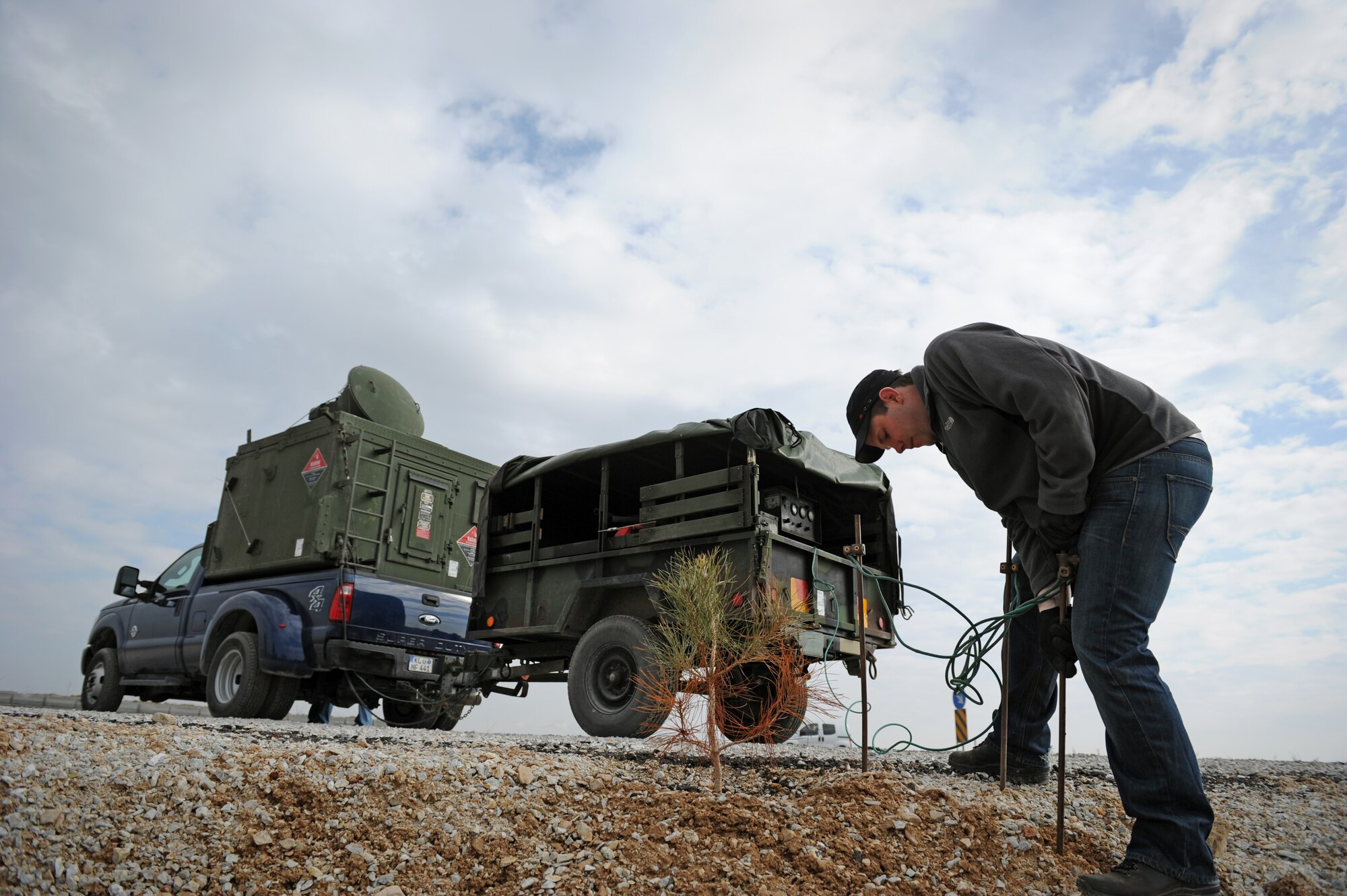 Carl Gessman, a Polygone radar operator, attaches grounding rods for a generator used to power a tactical radar threat generator during Anatolian Falcon 2012 in Konya, Turkey, March 8, 2012. The radar provided a simulated enemy ground threat capability to the pilots participating in the exercise. (U.S. Air Force photo/Staff Sgt. Benjamin Wilson)