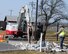 Workers begin the process of removing the pop-up barriers located near the main gate at Niagara Falls Air Reserve Station, N.Y. on March 7, 2012. Several issues including possible environmental impact is the reason a decision was made to replace them. Pop-up barriers are one of many standard measures used to help protect people who work and visit federal facilities. An integral part of the new system is manufactured locally by a western New York company. The main gate is scheduled to be closed until the end of March when work is completed on the barrier. (US Air Force photo by Peter Borys)