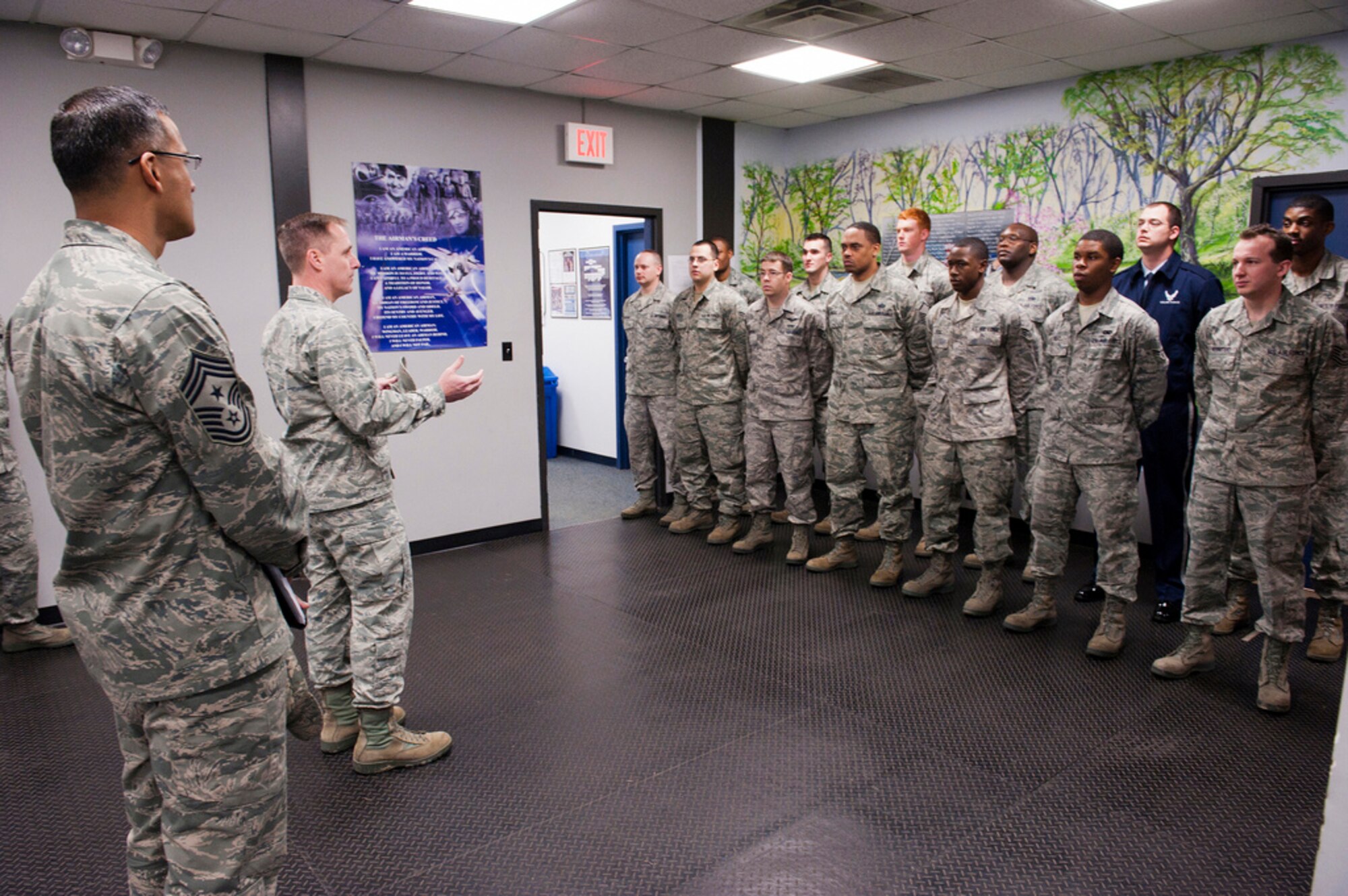 Colonel John Wood, Joint Base McGuire-Dix-Lakehurst commander, congratulates the JB MDL Air Force Honor Guard for winning the Air Mobility Command Honor Guard Team of the Year Award Feb. 1. The honor guard team is made up of 30 active duty and 7 national guard and reserve members. They attend on the average 33 memorial services a week and between 1,300 and 1,400 per year. The area of responsibility with all the Air National Guard units is around 2,400 per year. (U.S. Air Force photo by Russ Meseroll/Released)