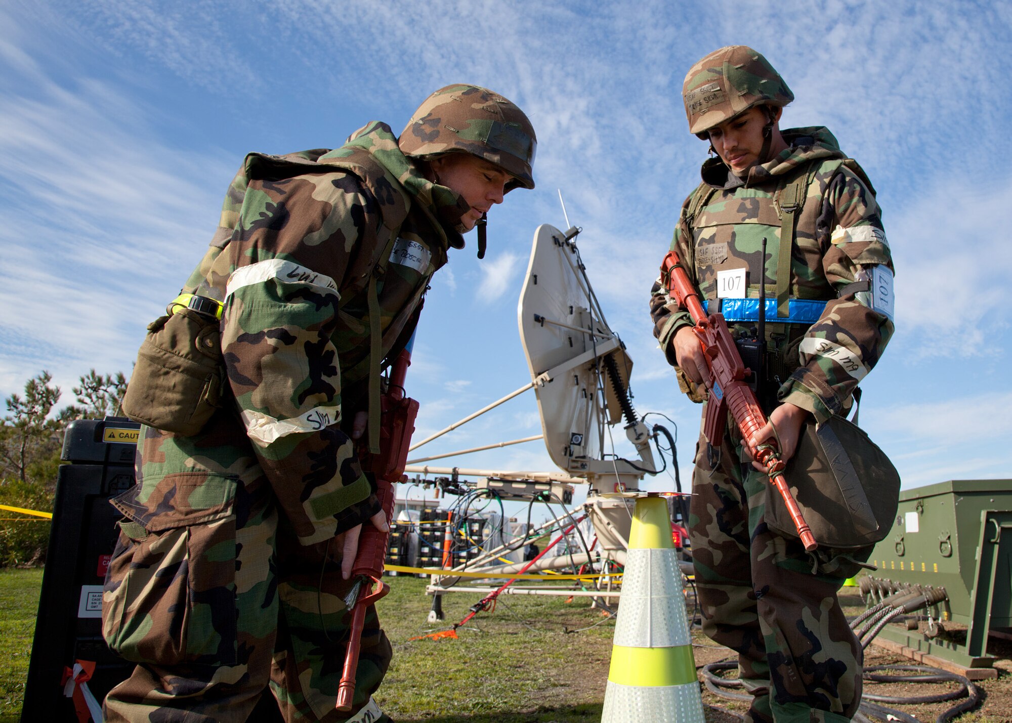 TRAVIS AIR FORCE BASE, Calif. -- Members of the 23rd Combat Communications Squadron, on the left is Staff Sgt. Dalance A. Boschee, and on the right is Staff Sgt. Jorge A. Silva, both are Transmission Systems Technicians, participate in an operational readiness exercise Feb. 9, 2012 at Travis. (U.S. Air Force photo by Lt. Col. Robert Couse-Baker)