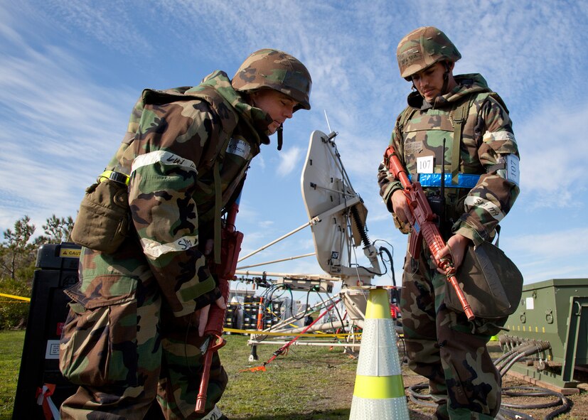 TRAVIS AIR FORCE BASE, Calif. -- Members of the 23rd Combat Communications Squadron, on the left is Staff Sgt. Dalance A. Boschee, and on the right is Staff Sgt. Jorge A. Silva, both are Transmission Systems Technicians, participate in an operational readiness exercise Feb. 9, 2012 at Travis. (U.S. Air Force photo by Lt. Col. Robert Couse-Baker)