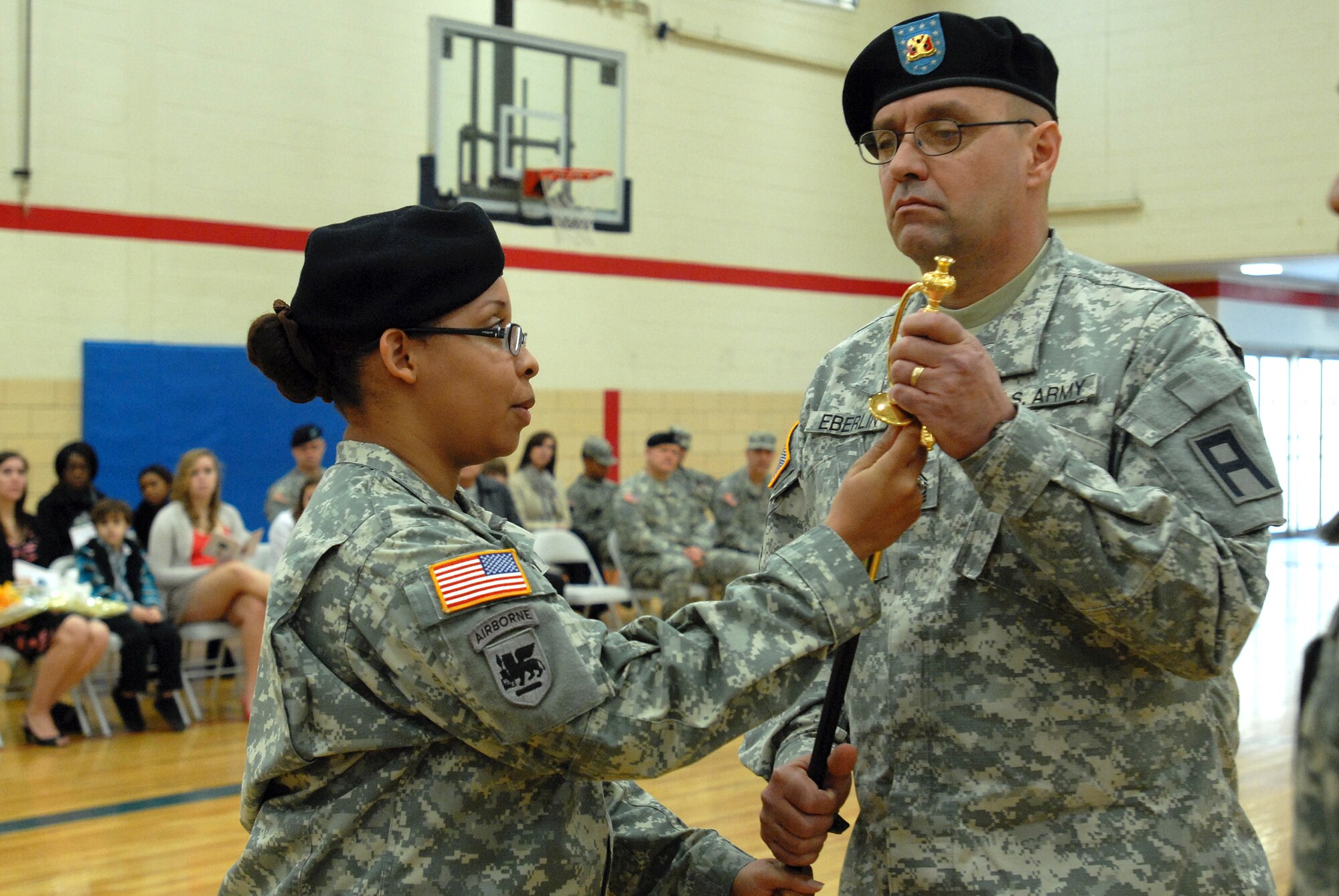 First Sgt. Brett Eberlin, incoming first sergeant of Headquarters and Headquarters Battery, 72nd Field Artillery Brigade, accepts the NCOs’ sword from Capt. LeKisha Hale, battery commander, during a change of responsibility ceremony March 4 at Joint Base McGuire-Dix-Lakehurst. Eberlin assumes responsibility of the battery from 1st Sgt. Darlene White. (U.S Army courtesy photo/Released)