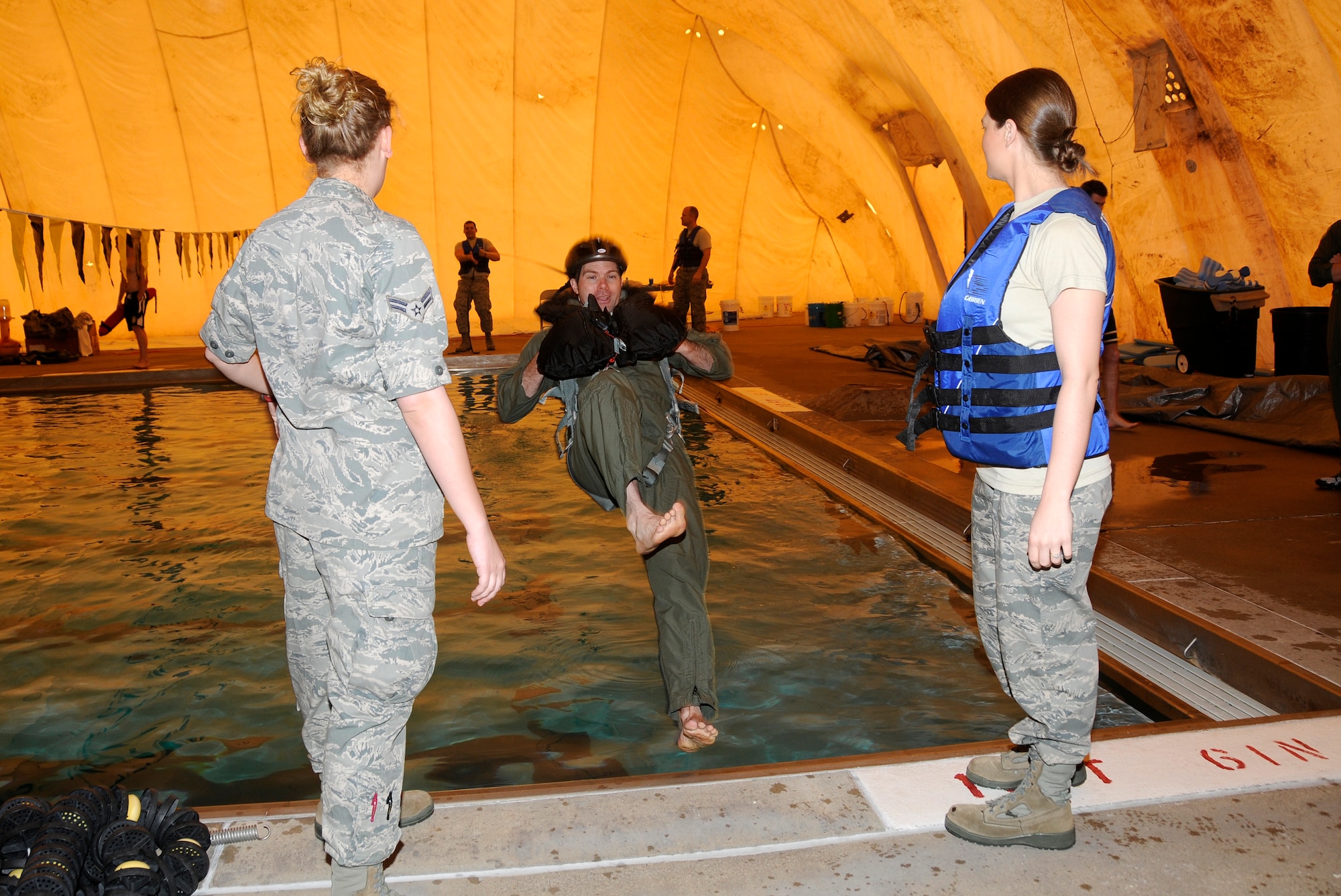Specialists with the 188th Operations Group’s Life Support Element administered water survival training to pilots with the 184th Fighter Squadron of the 188th Fighter Wing at Creekmore Park in Fort Smith, Ark., March 4, 2012. The training is required for aviators prior to deploying. The objective of the training is to prepare pilots for the potential of ejecting from their A-10C Thunderbolt II “Warthogs” while flying over water. The 188th Fighter Wing will deploy to Afghanistan this summer in support of Operation Enduring Freedom. It will be the unit’s second combat deployment in the A-10. (National Guard photo by Airman 1st Class Hannah Landeros/188th Fighter Wing Public Affairs)