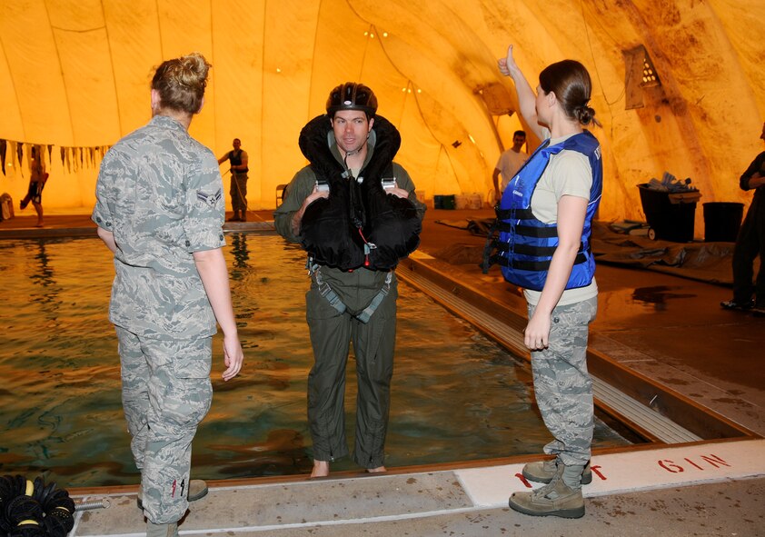 Specialists with the 188th Operations Group’s Life Support Element administered water survival training to pilots with the 184th Fighter Squadron of the 188th Fighter Wing at Creekmore Park in Fort Smith, Ark., March 4, 2012. The training is required for aviators prior to deploying. The objective of the training is to prepare pilots for the potential of ejecting from their A-10C Thunderbolt II “Warthogs” while flying over water. The 188th Fighter Wing will deploy to Afghanistan this summer in support of Operation Enduring Freedom. It will be the unit’s second combat deployment in the A-10. (National Guard photo by Airman 1st Class Hannah Landeros/188th Fighter Wing Public Affairs)