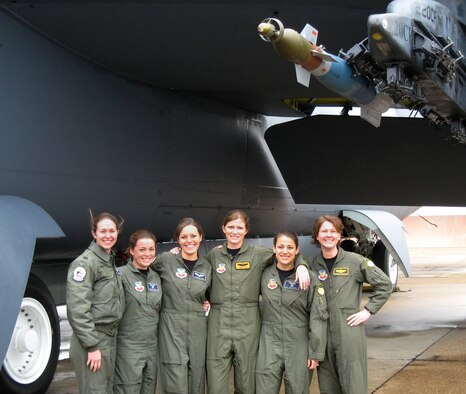 Female aircrew members pose for a photo under the wing of a B-52 Stratofortress on Barksdale Air Force Base, La., Jan. 22, 2008.  The crew members were the first all-women aircrew team to fly a B-52.  (Courtesy Photo)