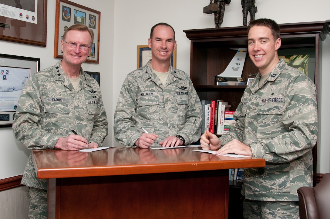 From left, Lt. Gen. David Fadok, commander and president of the Air University, Col. Brian Killough, commander of the 42nd Air Base Wing, and Capt. Charles Stallings of the 42nd Medical Group, the Air Force Assistance Fund coordinator, sign pledges in Fadok's office Tuesday. The AFAF campaign on Maxwell-Gunter runs until April 13. AFAF supports four charities whose benefits are only available to those in the Air Force family – the Air Force Aid Society, Air Force Village, Air Force Enlisted Village and the Gen. and Mrs. Curtis E. LeMay Foundation. See your AFAF unit representative to contribute. (Air Force photo/Sarah Byrd)