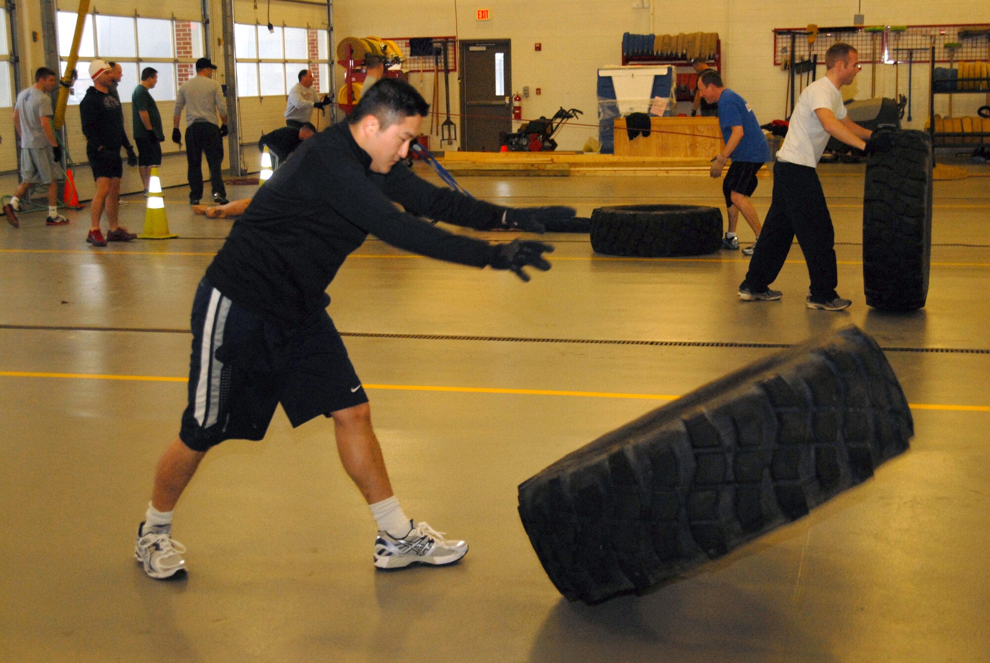 Senior Airman Danny Lee, a fire fighter with the 178th Civil Engineer Squadron flips a tire as part of the fire fighter's cicuit training March 4.at the Springfield Ohio Air National Guard base.
The tire flip was part of a 15 minute, five station circuit program that is conducted on Unit Training Assembly weekends.