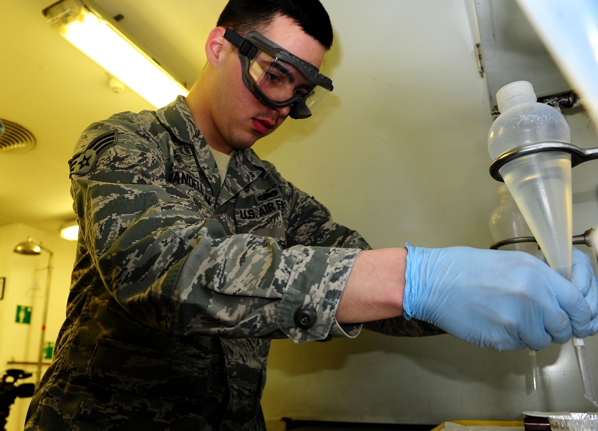 Air Force Senior Airman Michael Mandelbaum, 86th Logistics Readiness
Squadron fuels laboratory technician, verifies the quality of aircraft fuel
Distributed at Ramstein, Ramstein Air Base, Germany, March 6, 2012. The lab 
team is comprised of three highly trained Airmen who sampled over 131
million gallons of fuel in fiscal year 2011 by performing over 4,500
individual analyses. (U.S. Air Force photo/Airman Brea Miller)