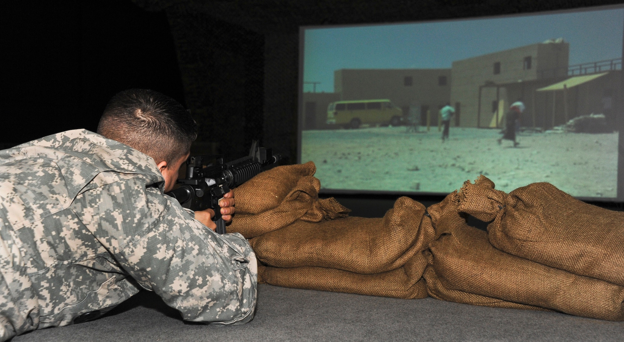Sergeant 1st Class Jeffrey Rios, 78th Training Division Regional Training Center-East instructor from Yonkers, N.Y., targets simulated enemies while using the Engagement Skills Trainer 2000 program at the 99th Regional Support Center during 2012’s Best Warrior Competition March 5 here. The Best Warrior Competition is a test of the Soldiers' military knowledge, skills and physical fitness. (Photo by Airman 1st Class Ryan Throneberry)