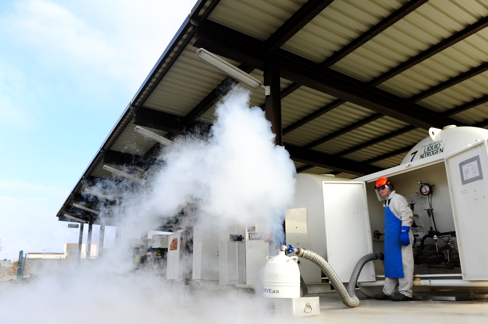 Air Force Staff Sgt. Robert Purnell, 86th Logistics Readiness Squadron
fuels cryogenics technician, fills a liquid nitrogen dewar, Ramstein Air
Base, Germany, March 6, 2012. LIN is used to support aircraft operations
and maintenance as well as lab environments. (U.S. Air Force photo/ Airman 
Brea Miller)