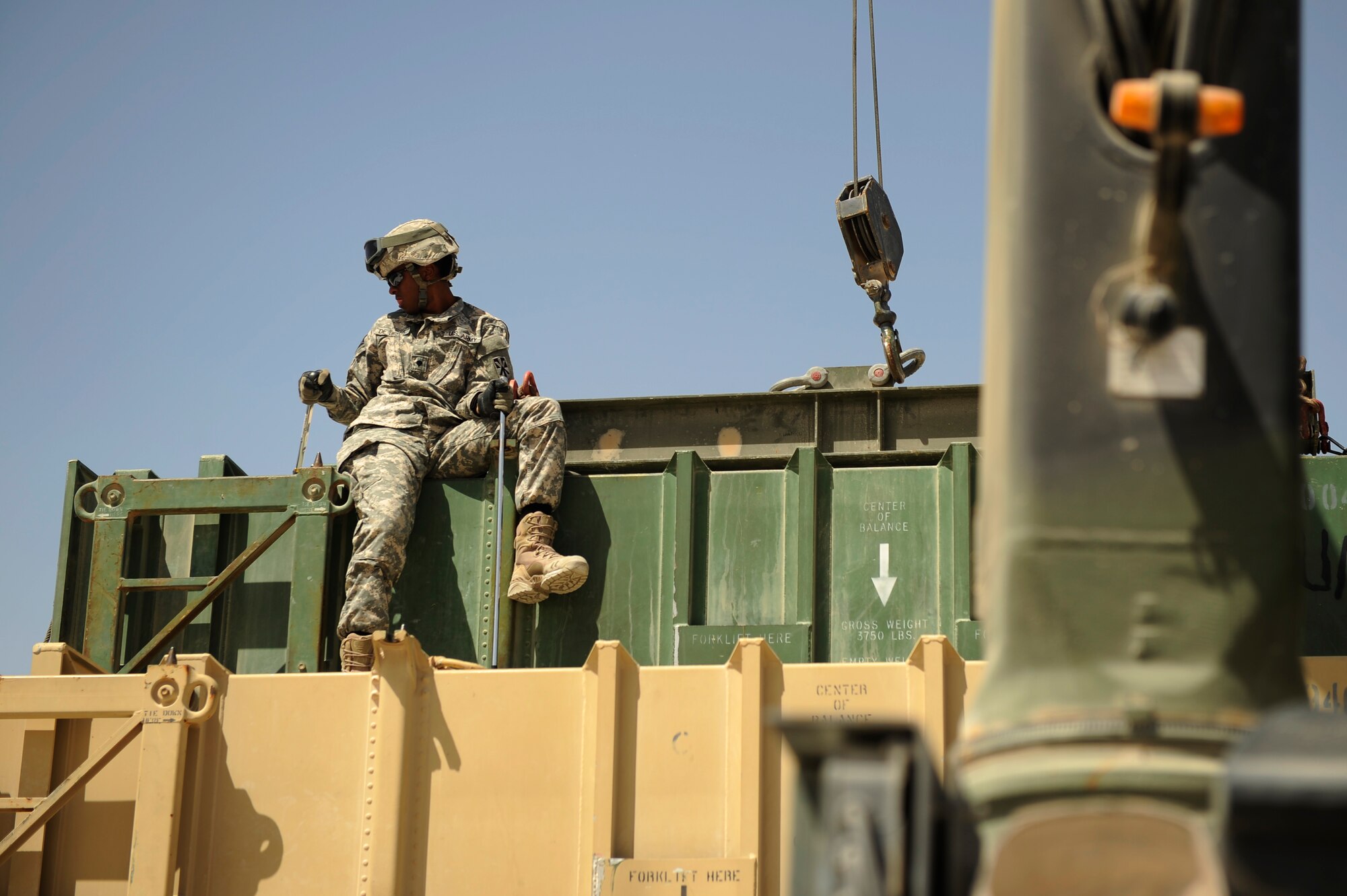 SOUTHWEST ASIA – U.S. Army Spc. Ernesto De Jesus, Bravo 5-52nd Air and Missile Defense Battery launcher station technician and native of Puerto Rico, fastens a launcher canister to a PAC-2 launcher during a crew drill here March 6, 2012. The Soldiers train on a PAC-2 launcher, which protects the region against aerial attack, missile attacks, and unauthorized surveillance. (U.S. Air Force photo/Staff Sgt. Nathanael Callon)